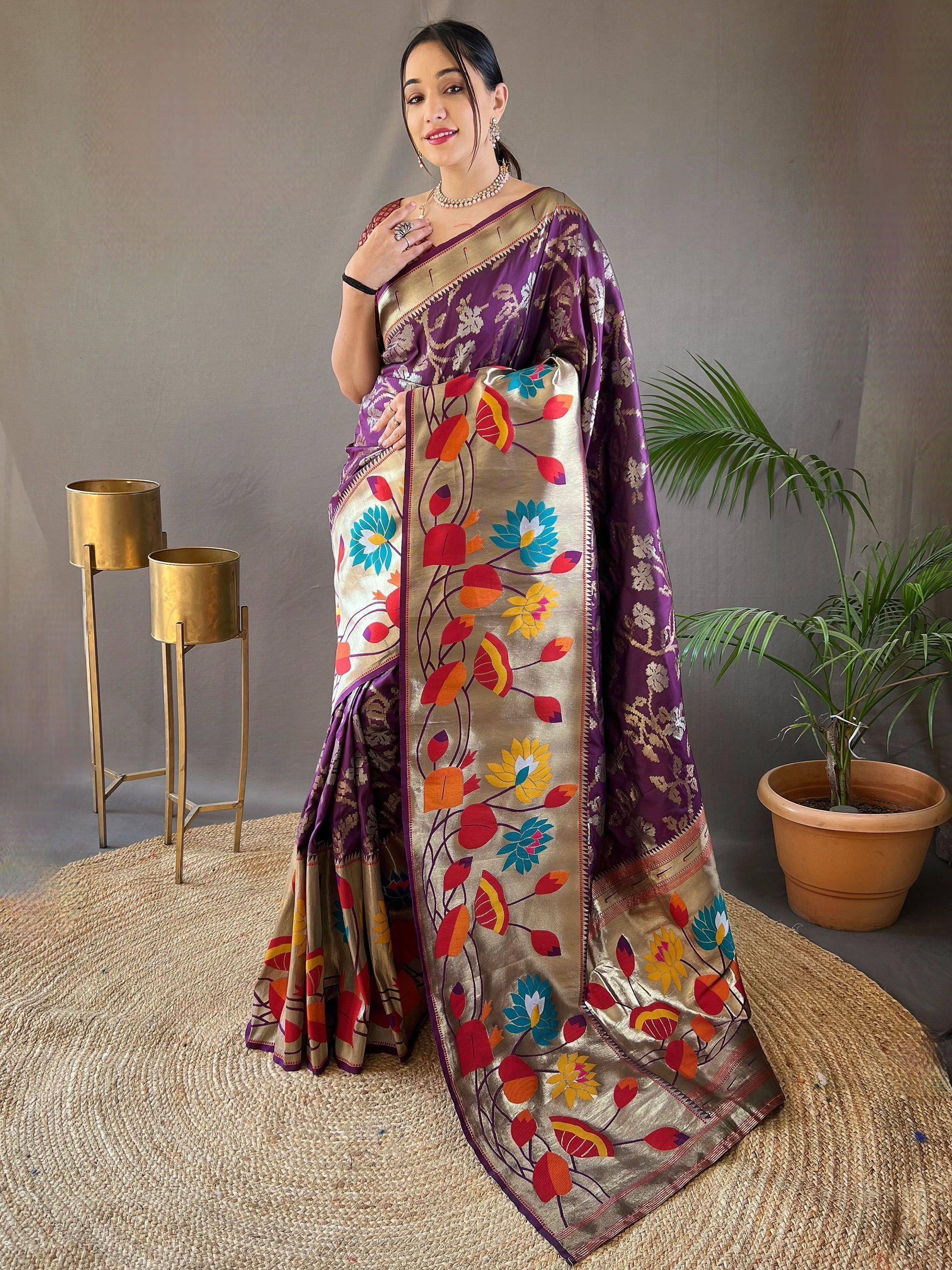Purple and gold floral saree with vibrant embroidered border, styled for Indian ethnic wear
