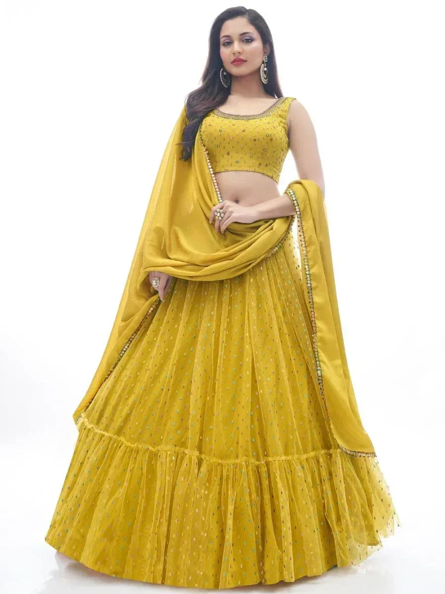 Yellow designer lehenga choli with sequin work and ruffled skirt for Indian ethnic wear