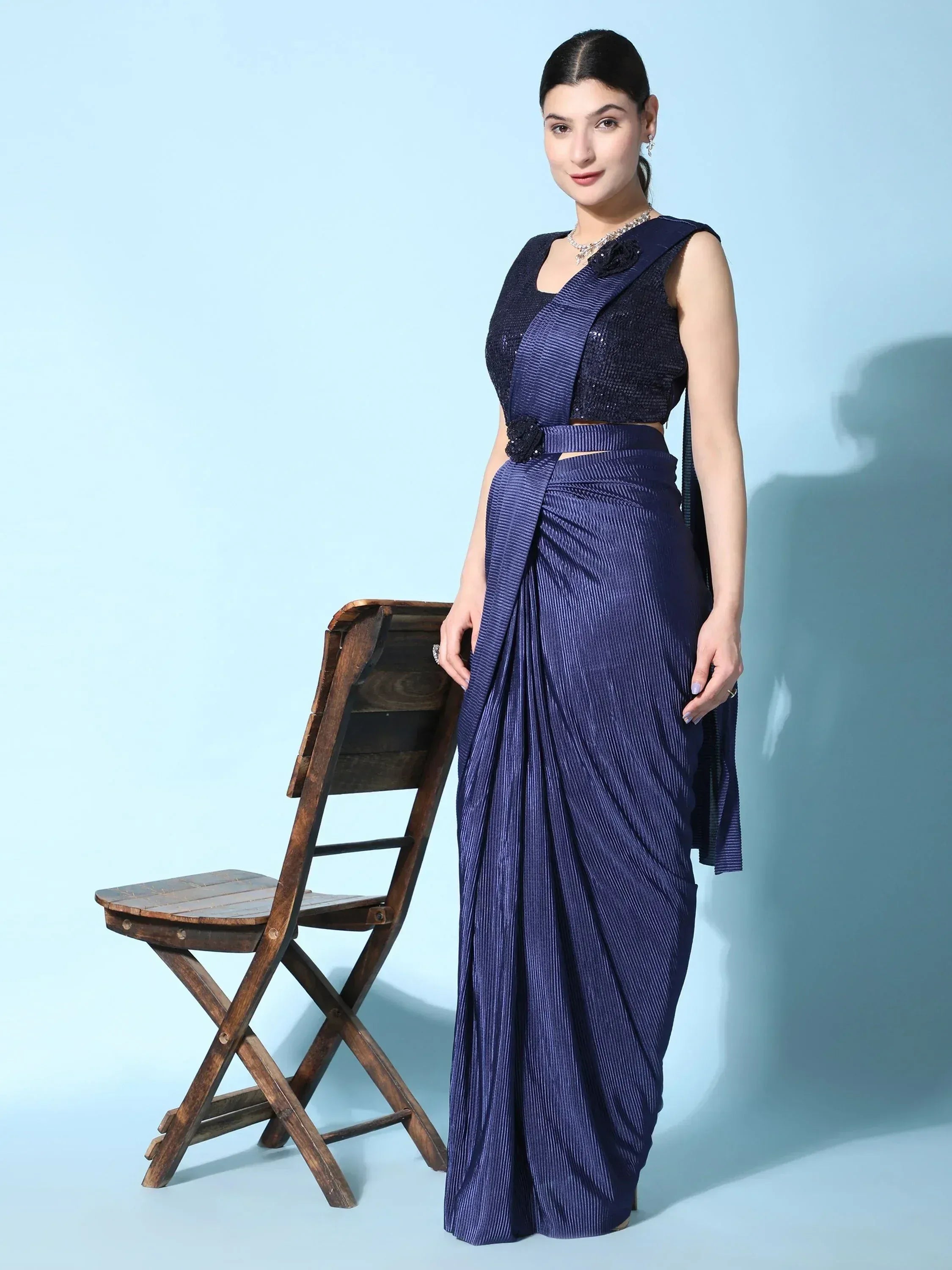 Elegant navy blue pleated saree with sequined blouse, styled for Indian ethnic wear