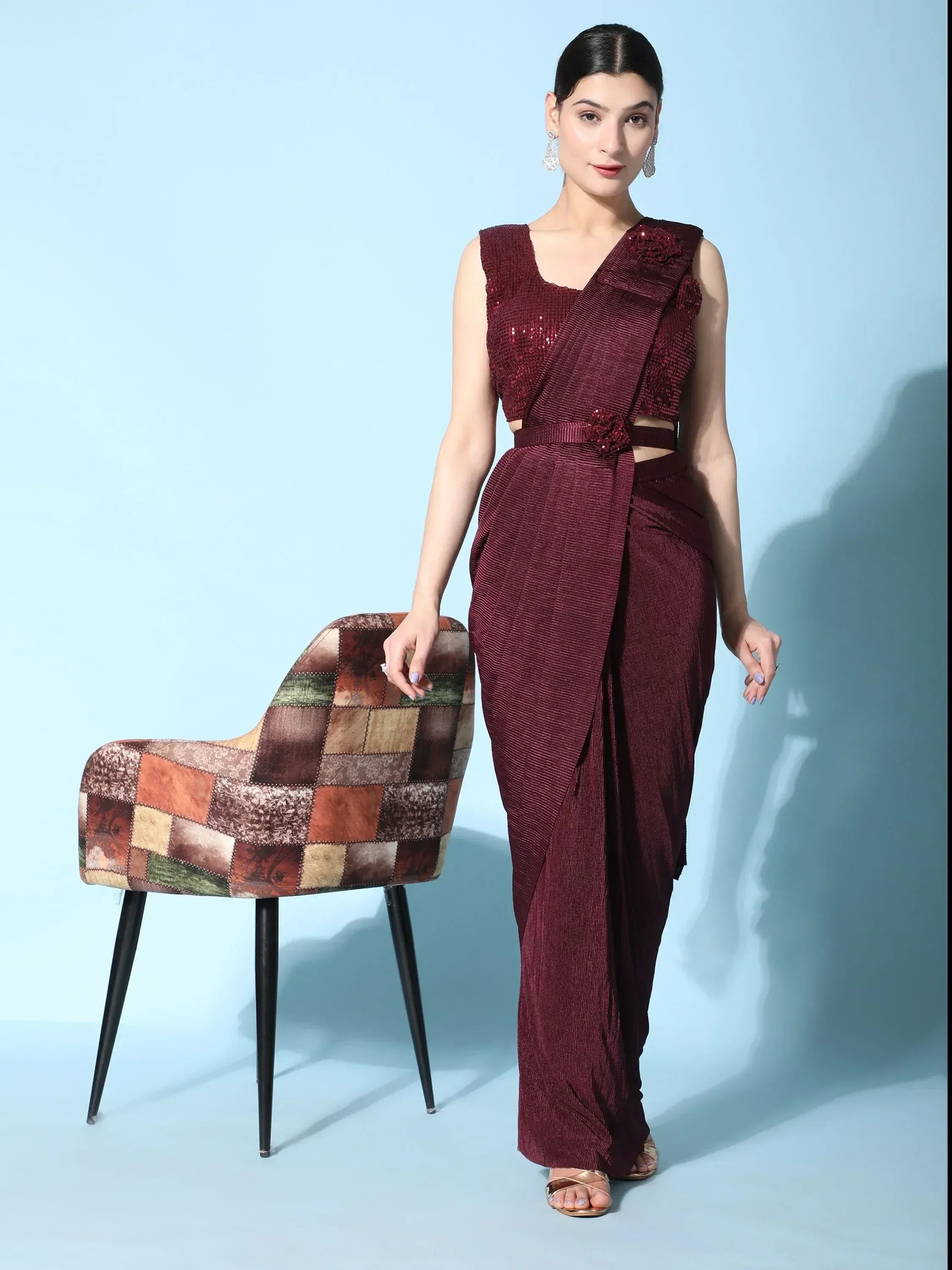 Maroon ethnic gown with sequin top and draped pants, styled for Indian festive wear