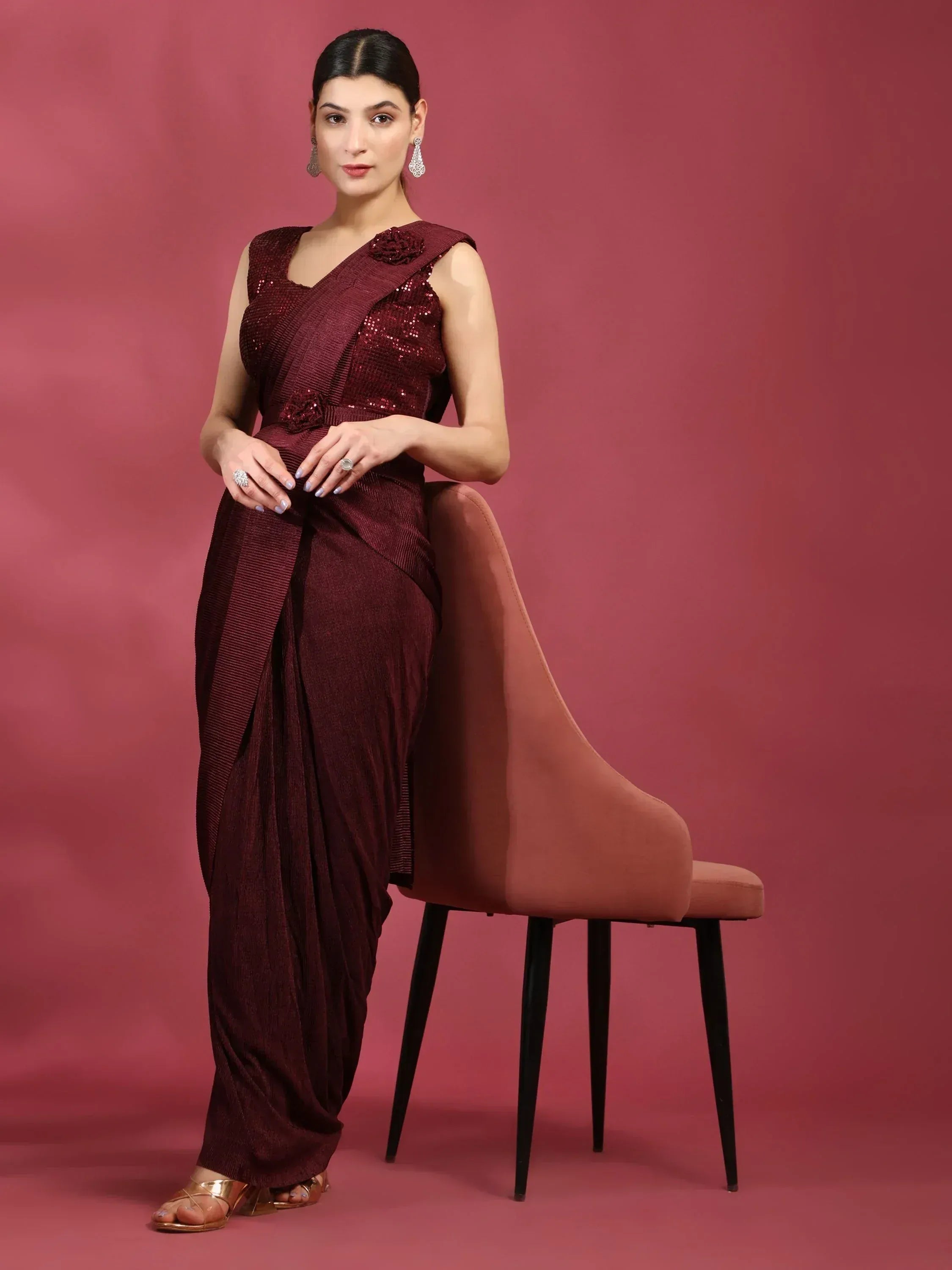 Elegant maroon ethnic gown with sequins and floral detail, perfect for Indian festive occasions