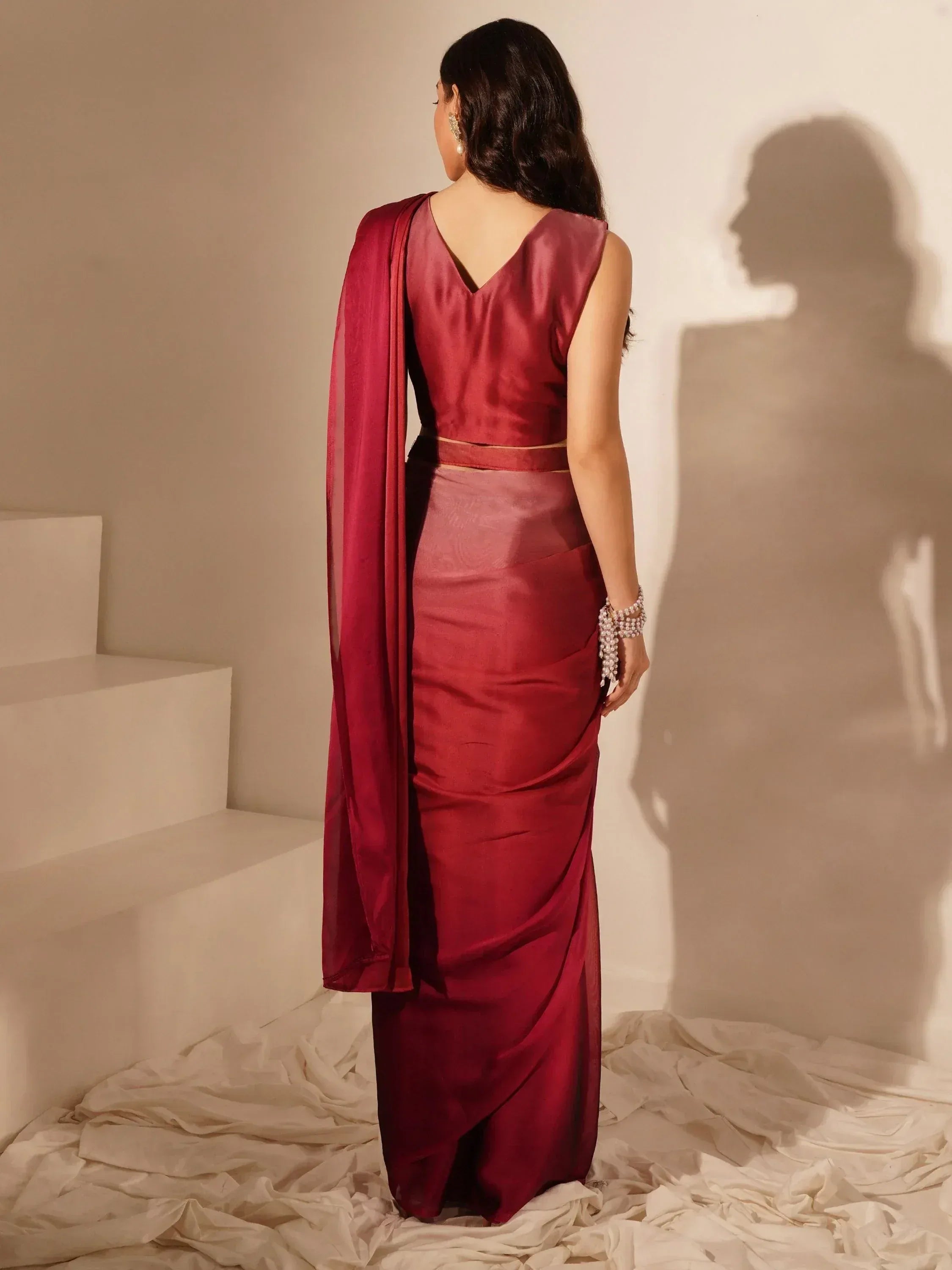 Elegant maroon saree with V-neck blouse, perfect for Indian ethnic wear occasions