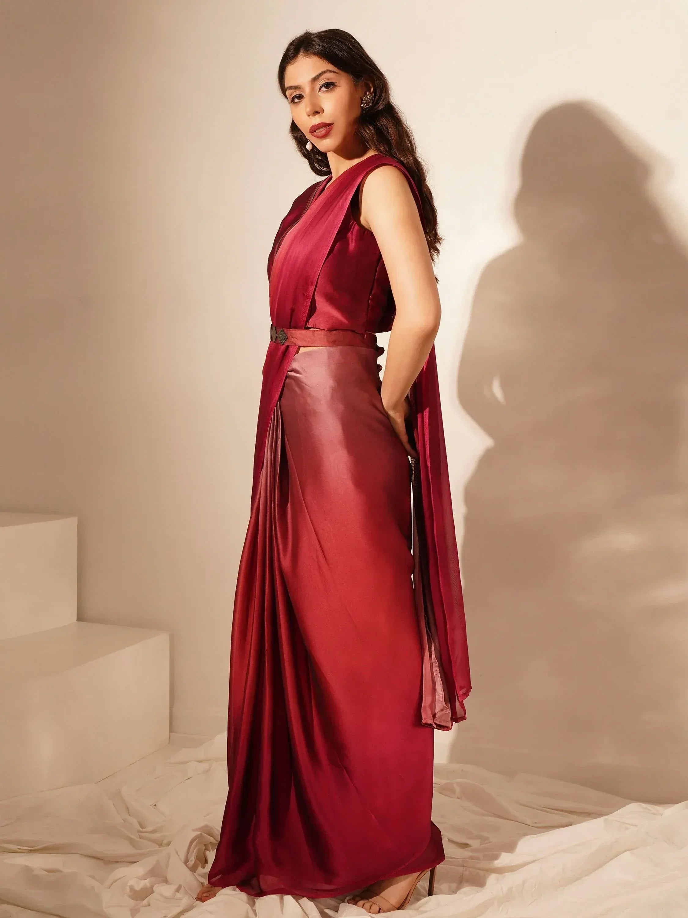 Maroon satin ethnic gown with draped design, perfect for Indian occasions and festive wear