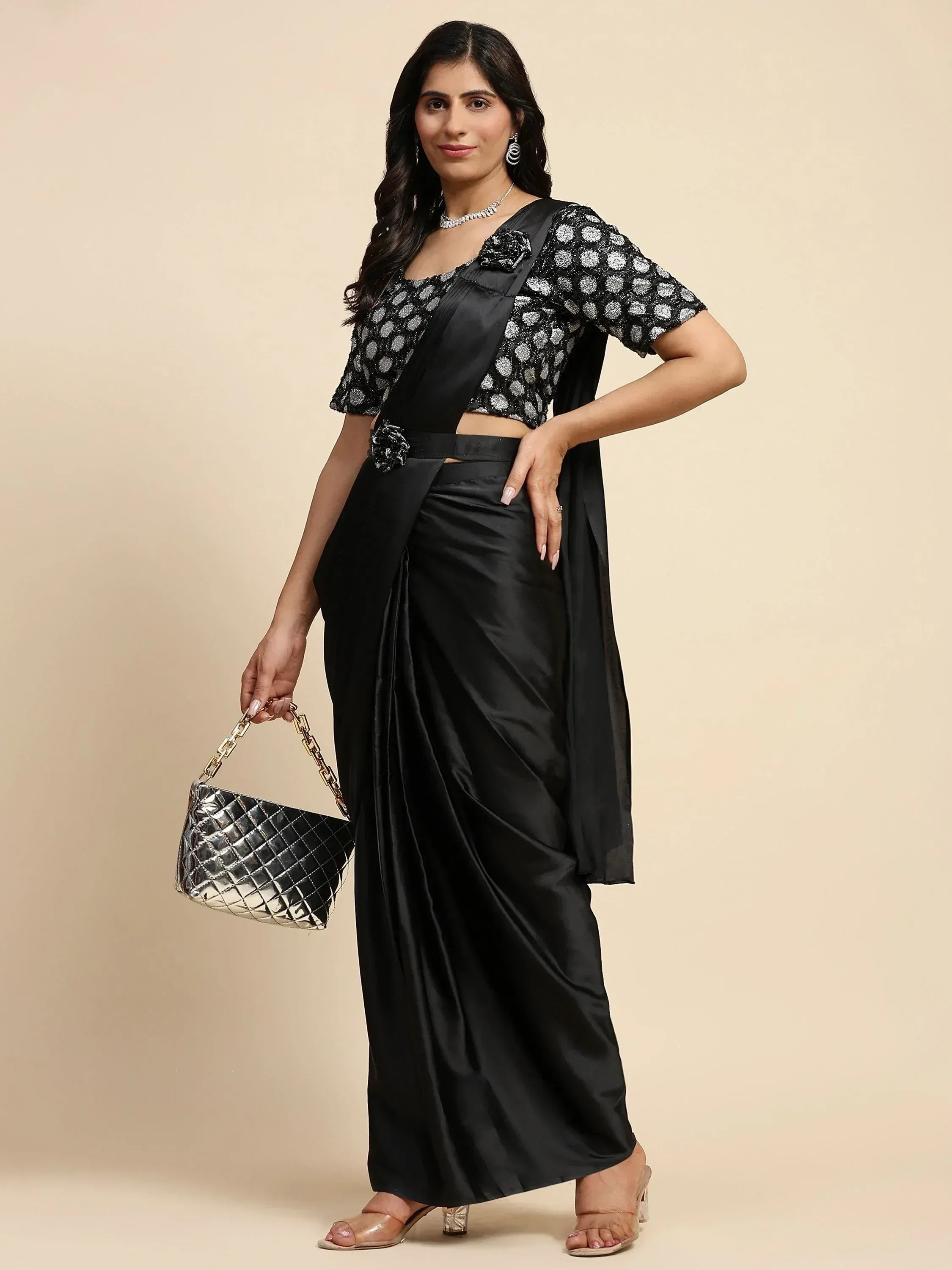 Black satin saree with sequin polka dot blouse, perfect for Indian ethnic wear occasions.