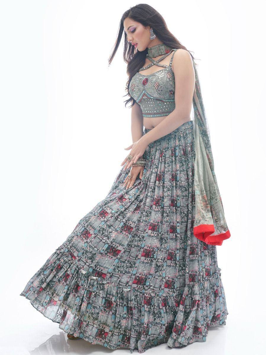 Designer lehenga choli with floral print skirt and embellished crop top, perfect for ethnic occasions