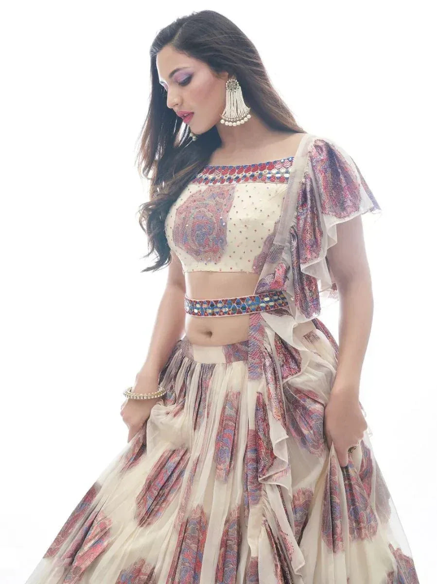 Elegant cream lehenga choli with floral print and embellished waistband, perfect for Indian ethnic occasions