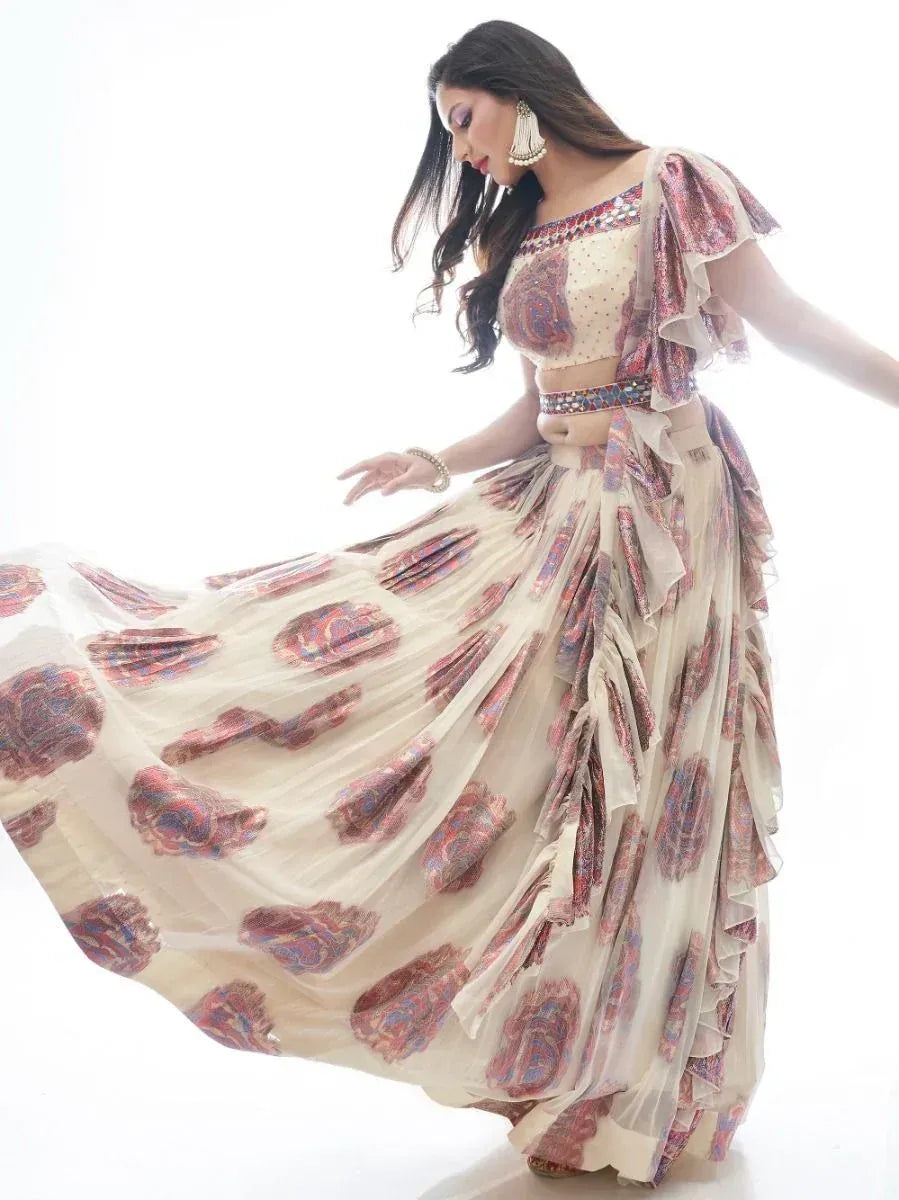Woman in flowing printed lehenga choli with ruffled sleeves and ethnic jewelry, perfect for festive occasions