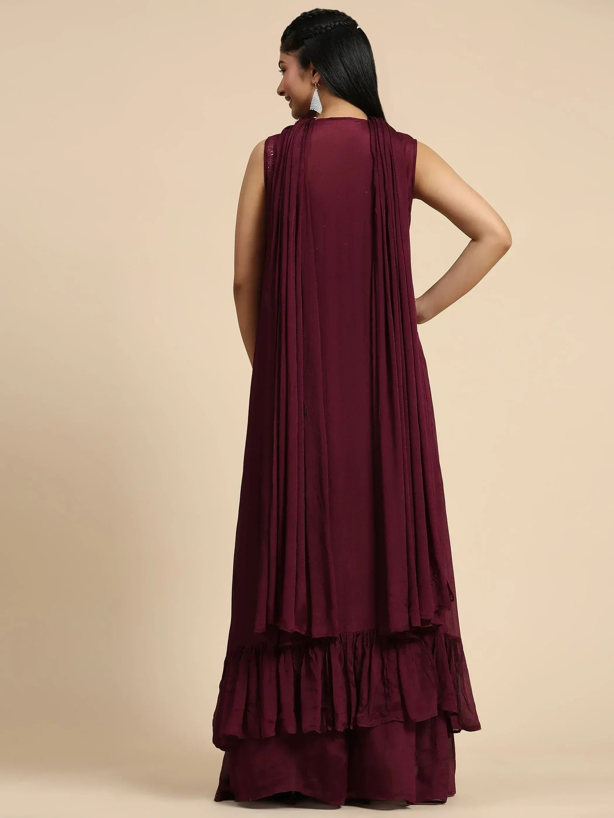 Maroon ethnic gown with pleated back and ruffled hem, perfect for Indian occasions
