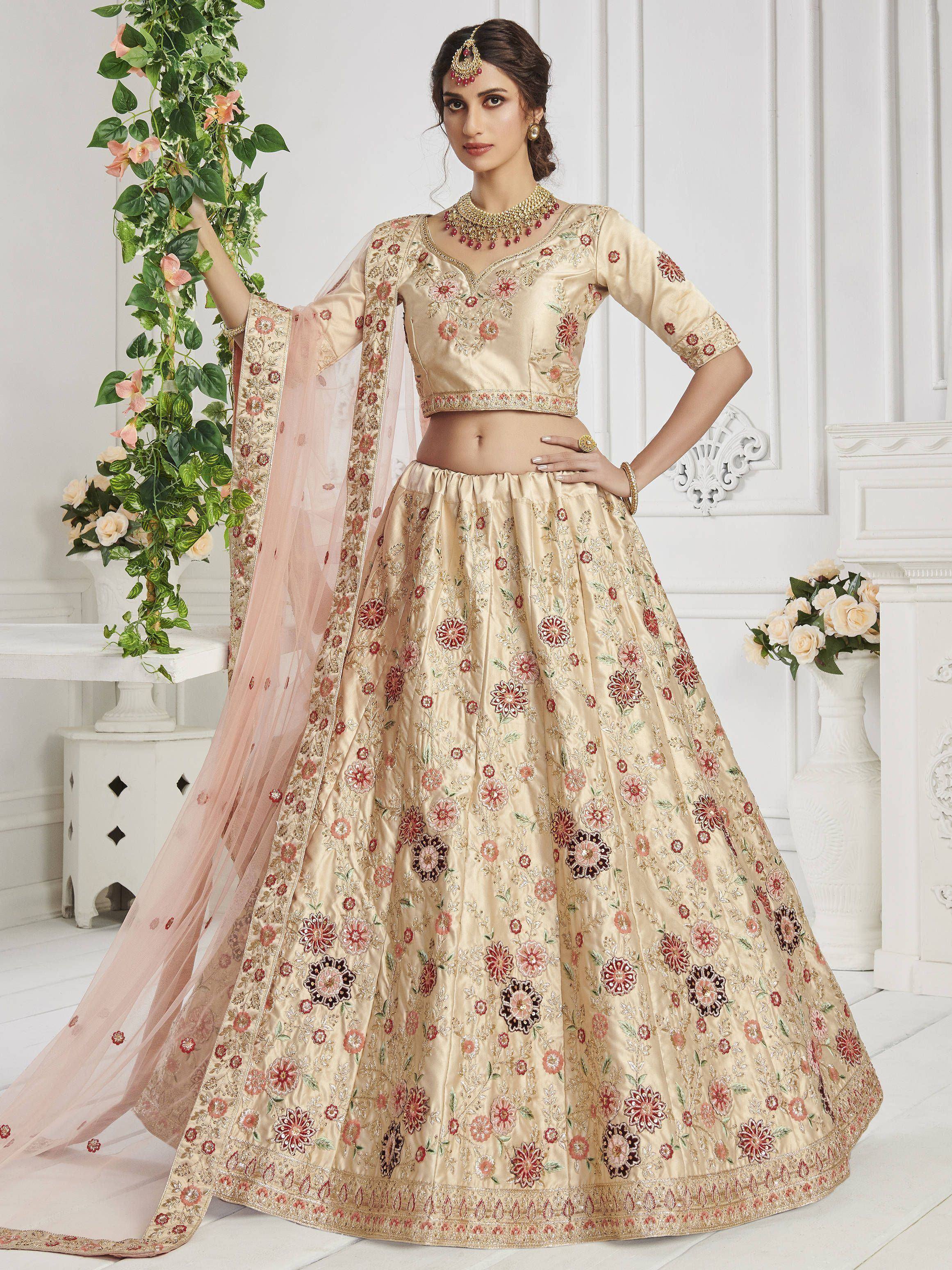 Beige floral embroidered lehenga choli with pink dupatta, perfect for Indian weddings and festive occasions