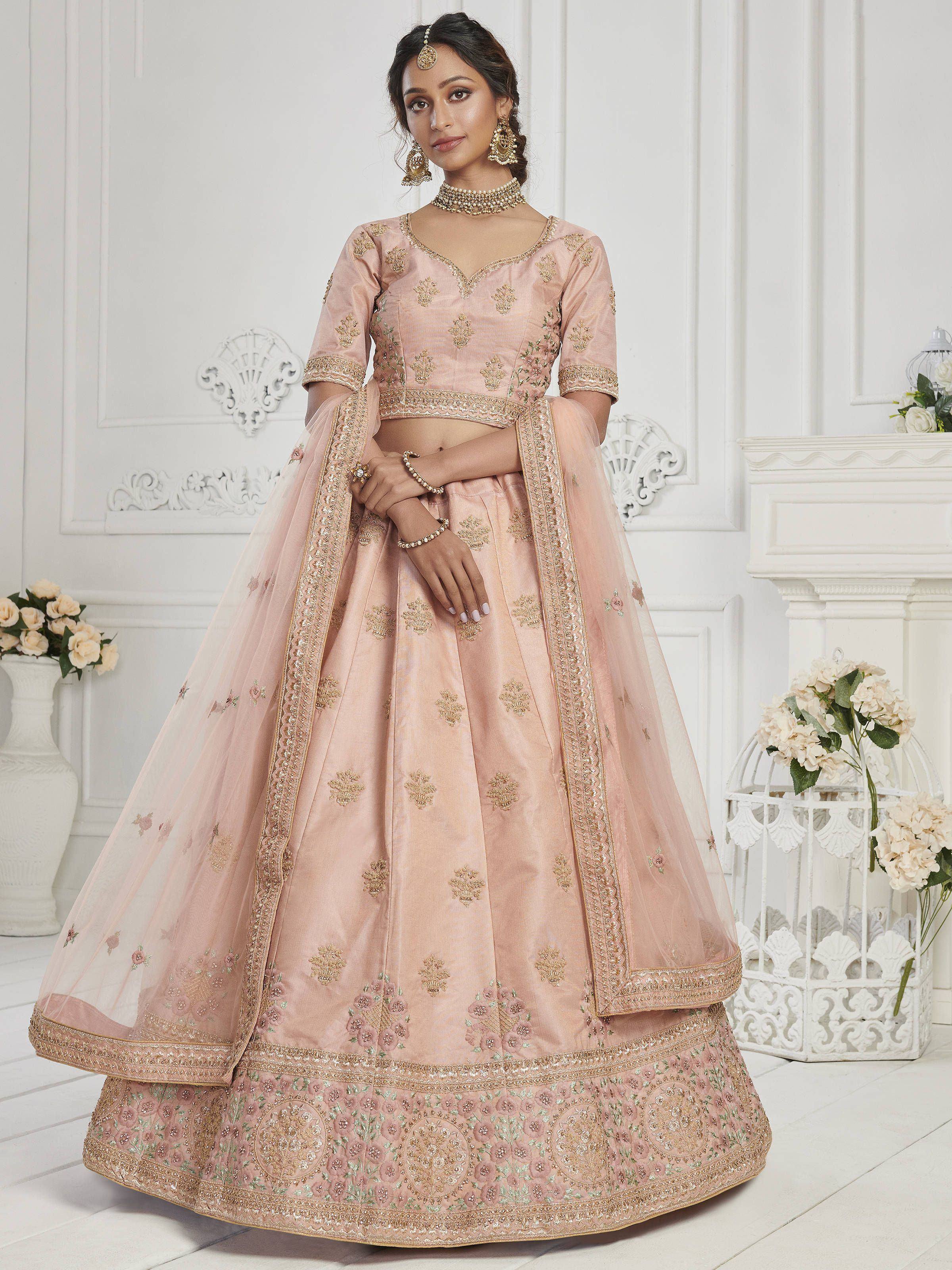 Pink embroidered lehenga choli with gold detailing, perfect for Indian weddings and festive occasions