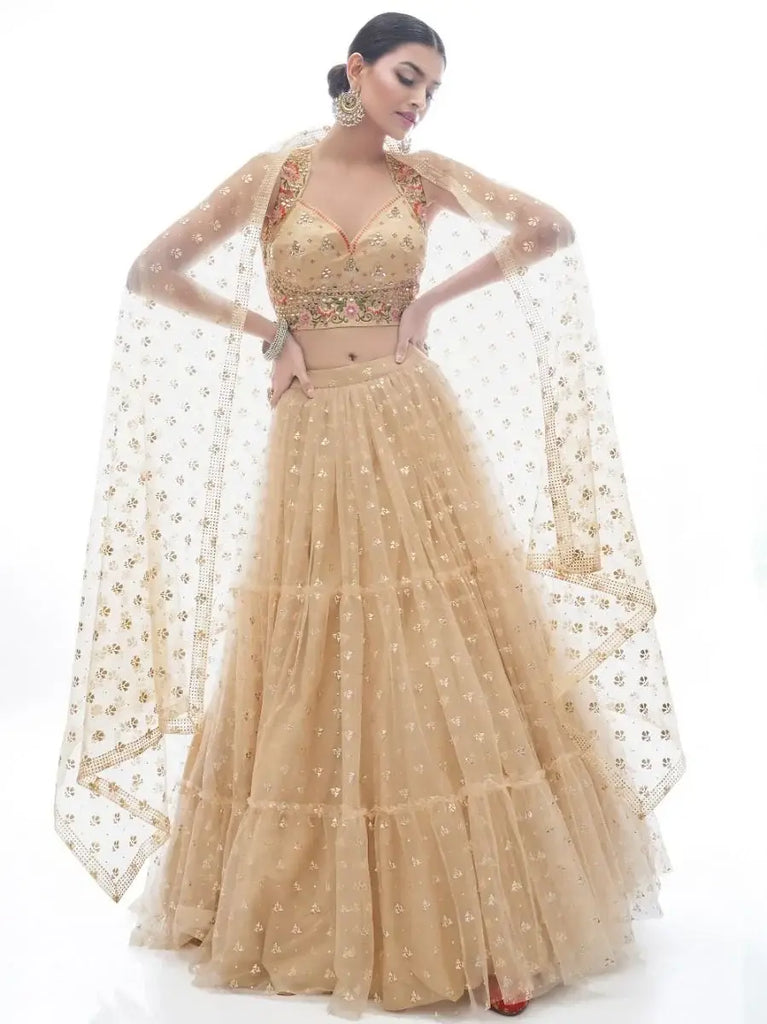 Attractive Beige Ruffle Work Net Lehenga With Embroidered Choli