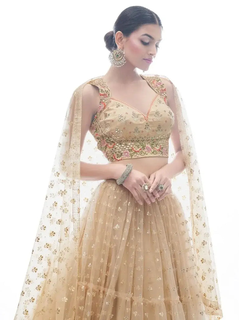 Attractive Beige Ruffle Work Net Lehenga With Embroidered Choli