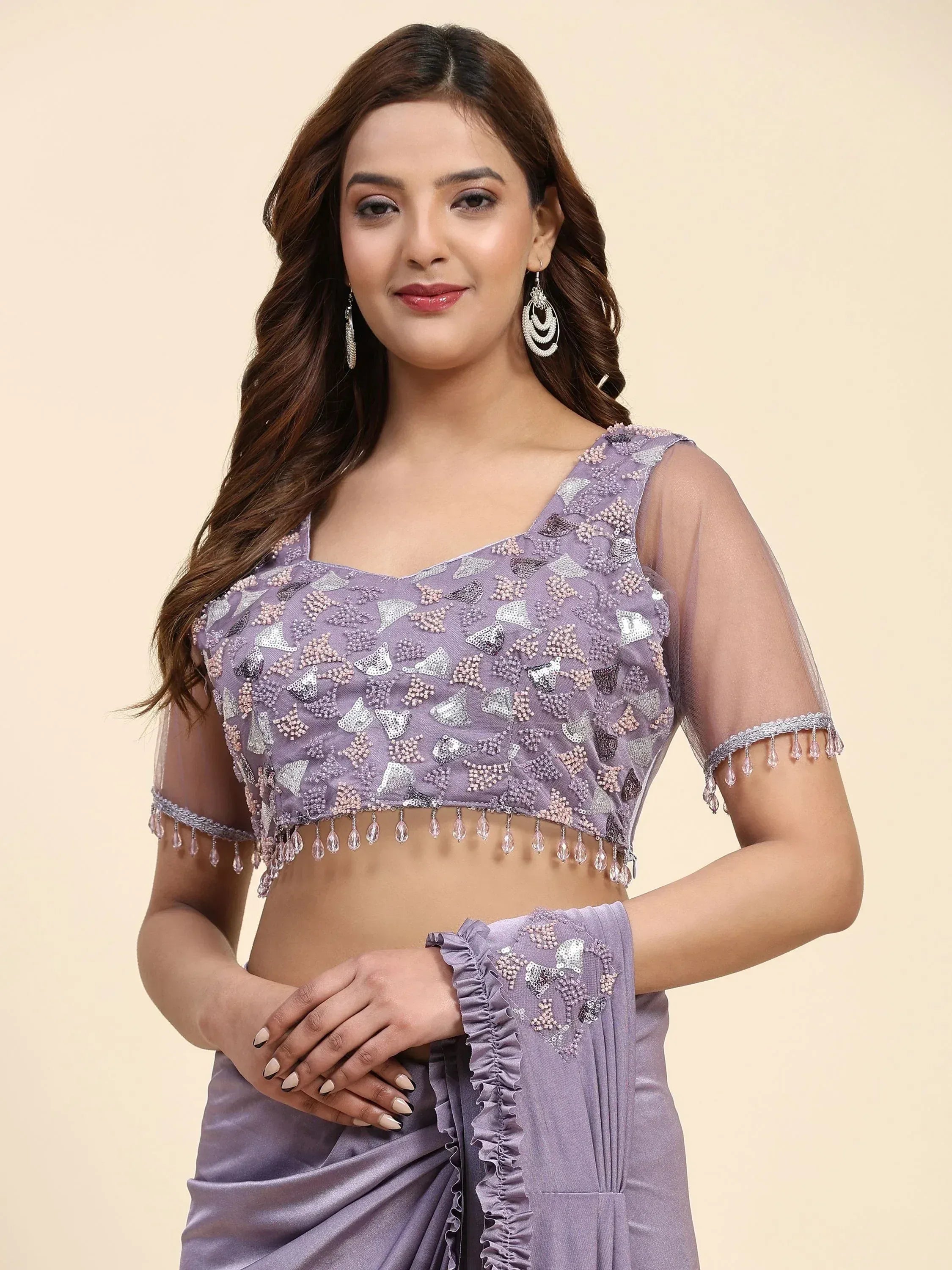 Lavender ethnic saree with sequin-embellished blouse and sheer sleeves, perfect for Indian occasions.