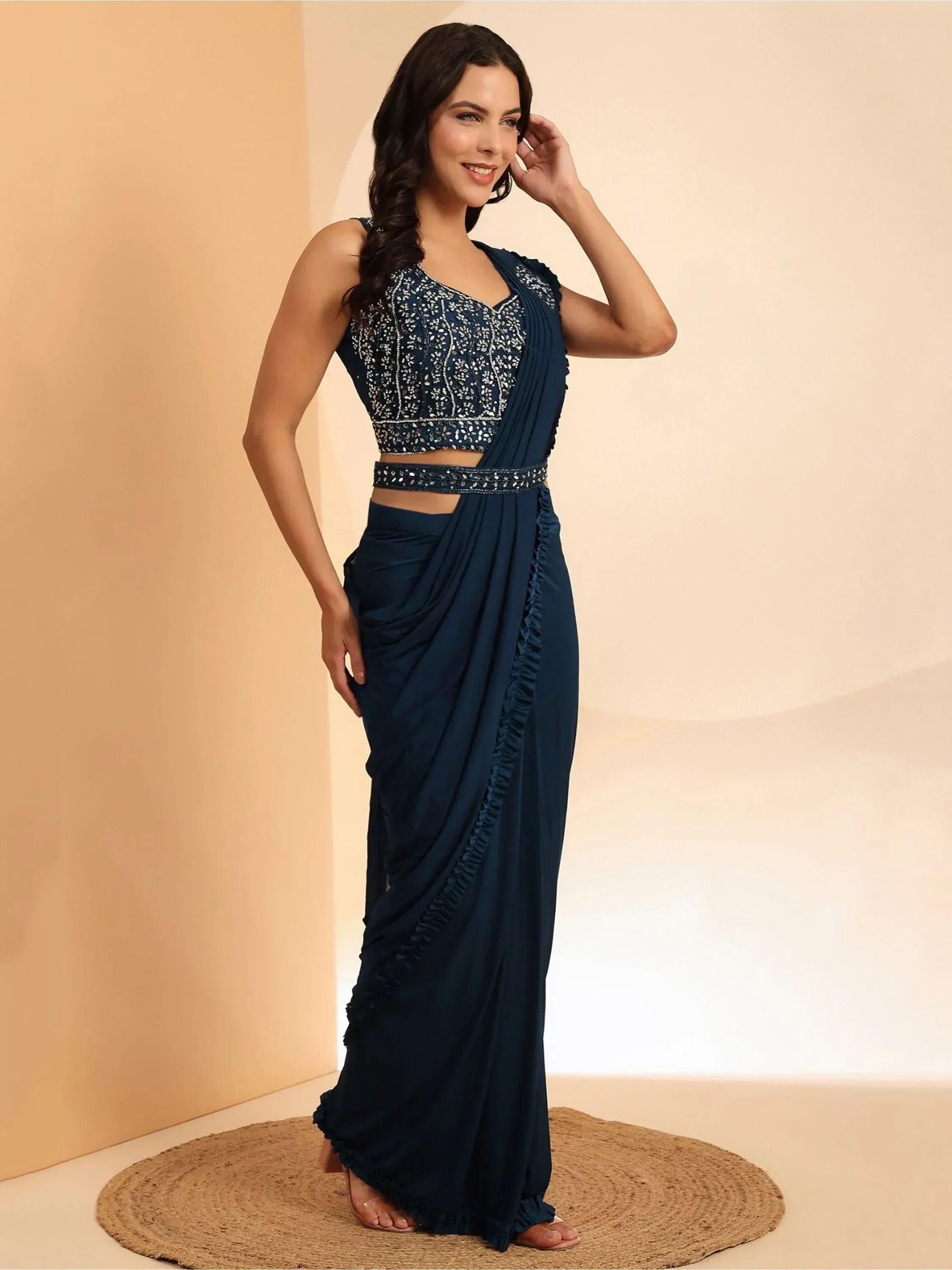 Navy blue embroidered saree gown with ruffled detailing, perfect for Indian ethnic occasions