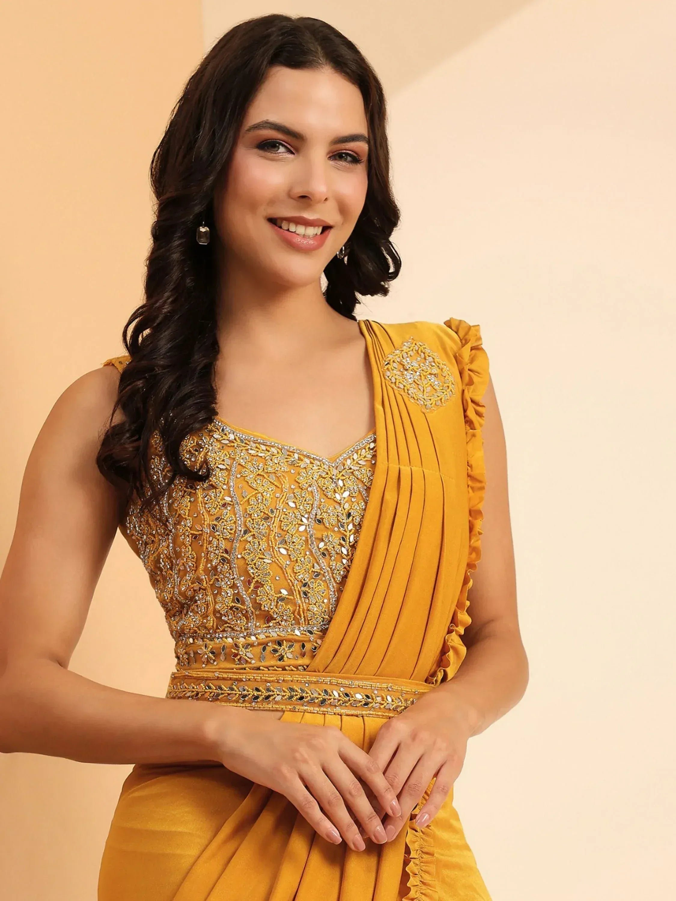 Yellow designer saree with heavy embroidery and ruffled sleeves, perfect for Indian ethnic wear