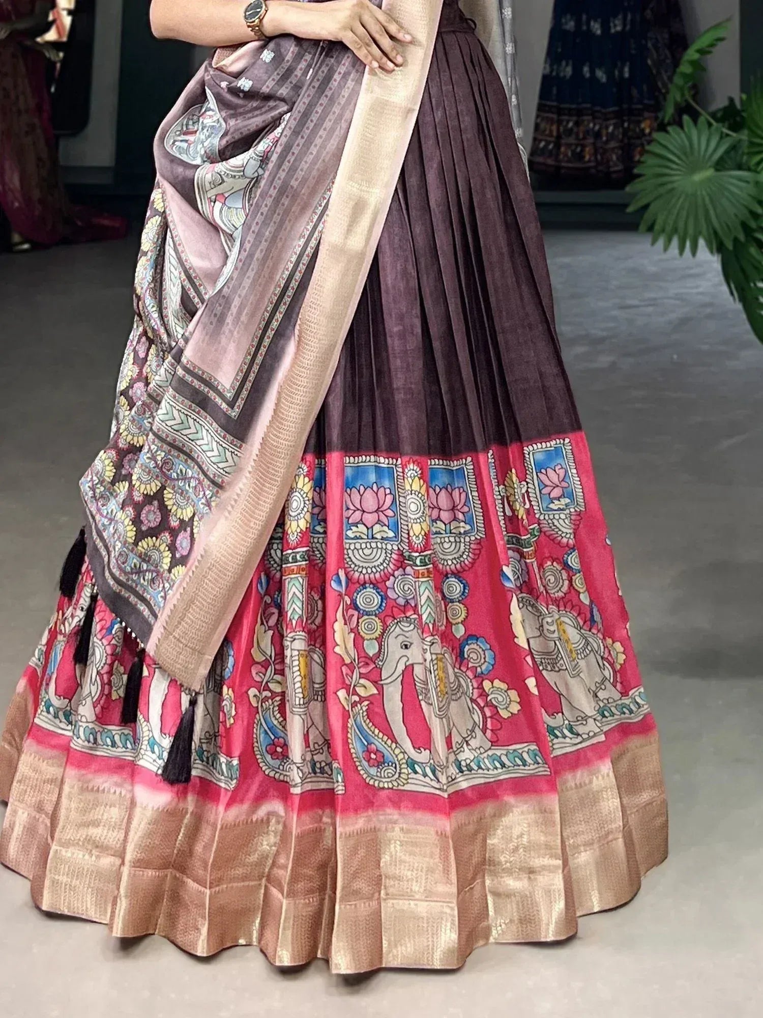 Ethnic printed lehenga with elephant motifs, floral border, and contrasting dupatta for festive wear