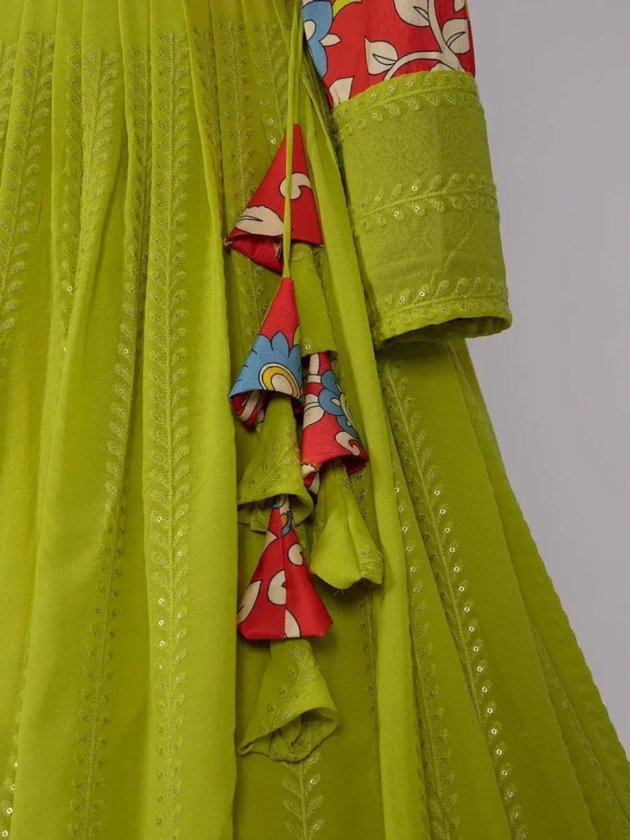 Lime green ethnic gown with floral print sleeves and sequin embroidery, perfect for Indian occasions.