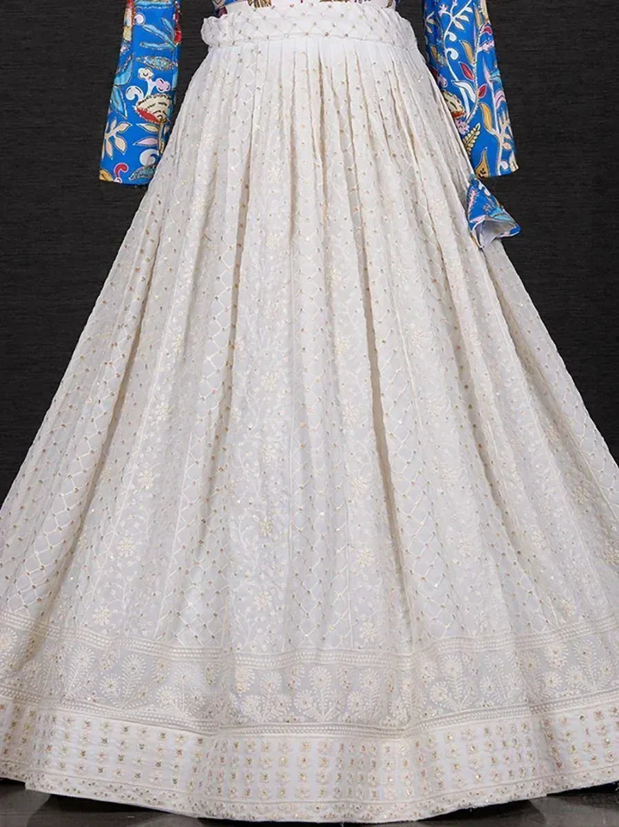 White embroidered lehenga with blue floral blouse, ethnic Indian wear for weddings and festivals