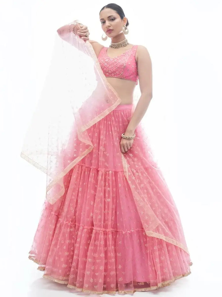 Outstanding Pink Ruffle Work Net Lehenga With Embroidered Choli