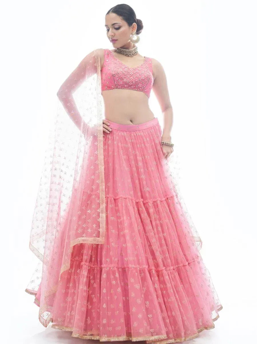 Pink embroidered lehenga choli with layered skirt and sheer dupatta, perfect for Indian ethnic occasions