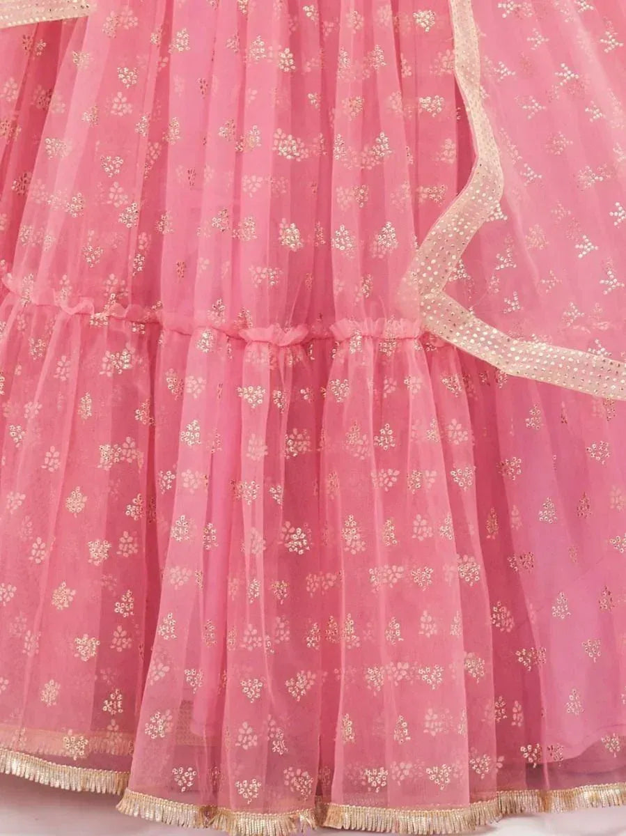 Pink embroidered lehenga with gold floral motifs and tassel trim, ideal for Indian ethnic wear