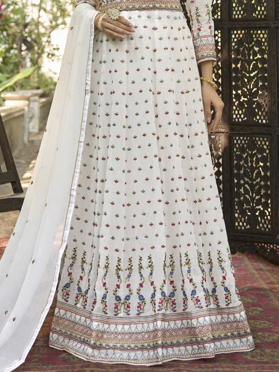 White embroidered lehenga choli with floral motifs and dupatta, perfect for Indian ethnic wear occasions.
