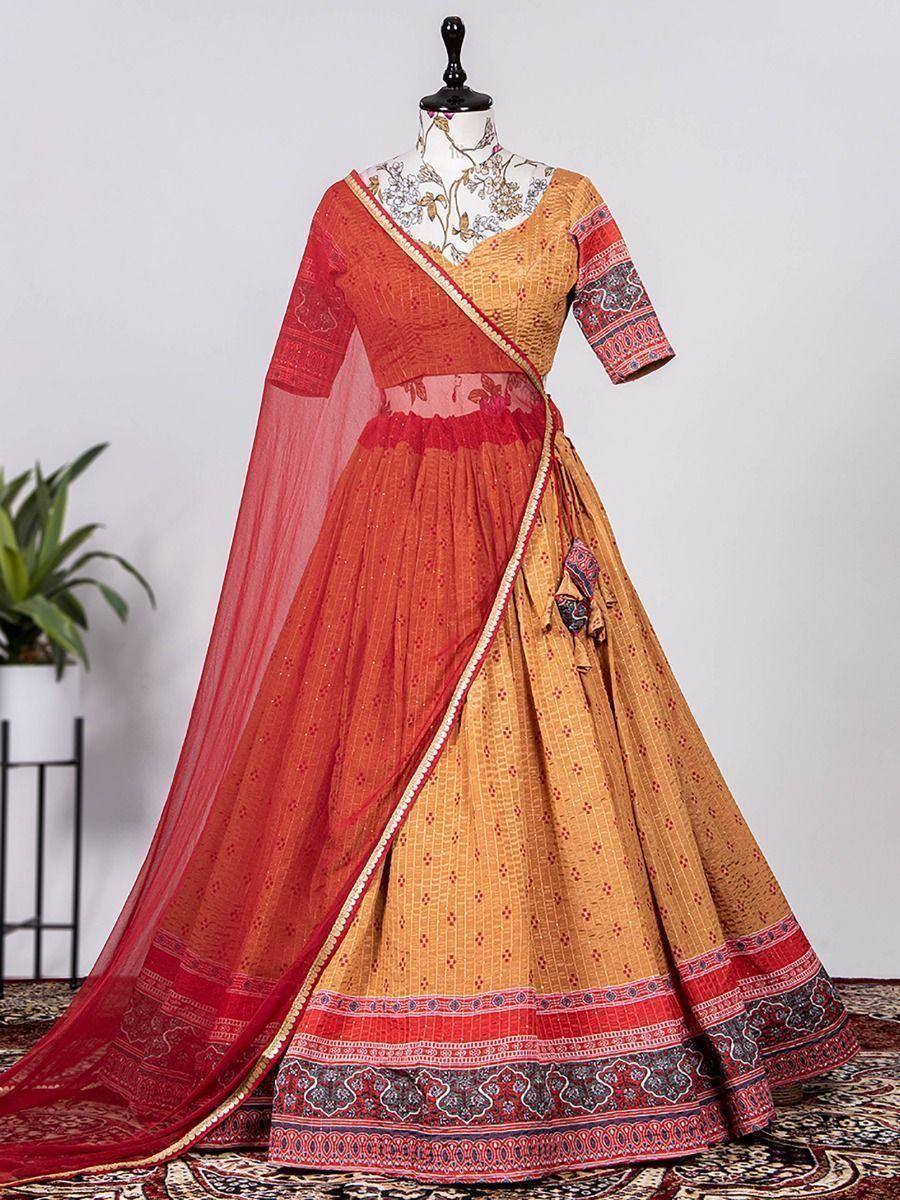Orange and red printed lehenga choli with sheer dupatta, ethnic Indian wear for weddings and festivals
