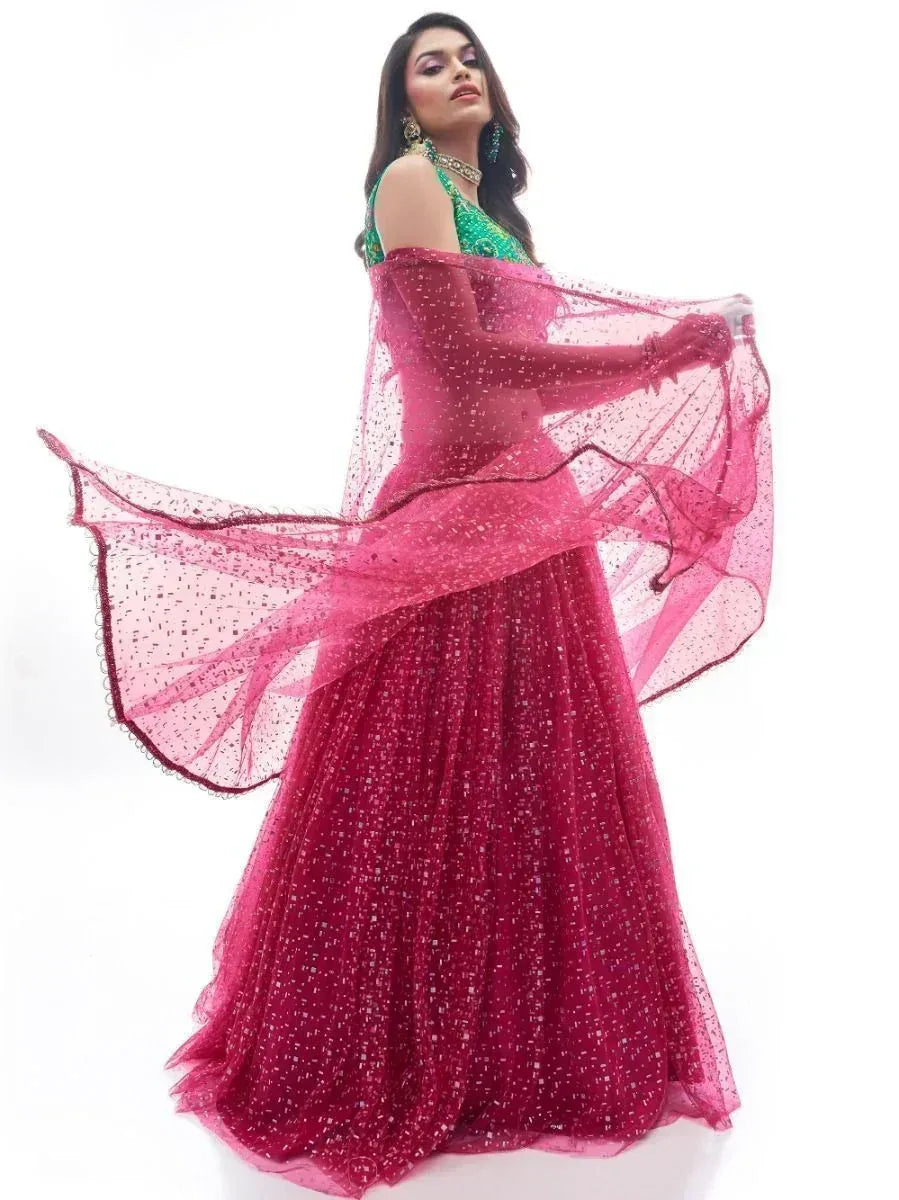 Elegant pink sequin lehenga choli with flowing dupatta, perfect for Indian ethnic occasions