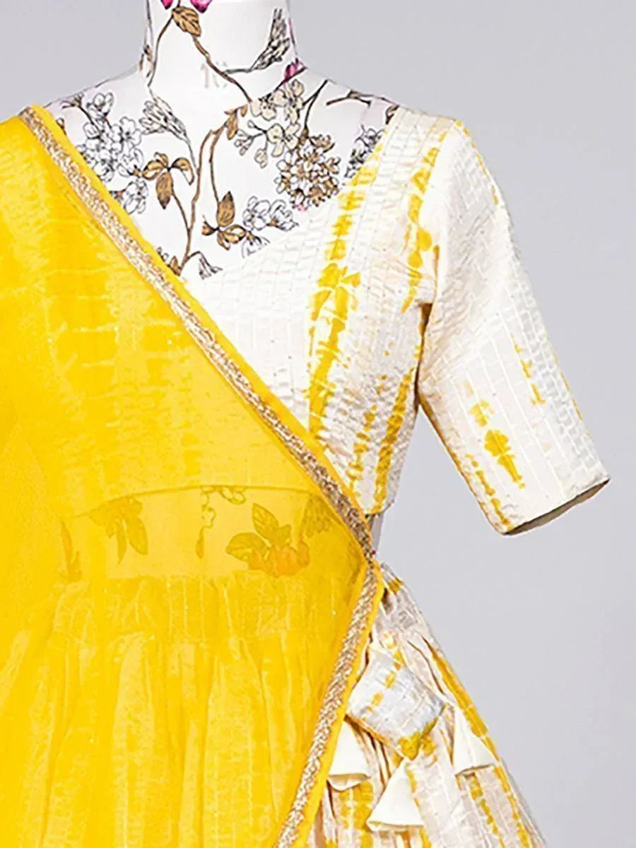 Yellow and white ethnic saree with floral blouse, perfect for Indian occasions and festivals.