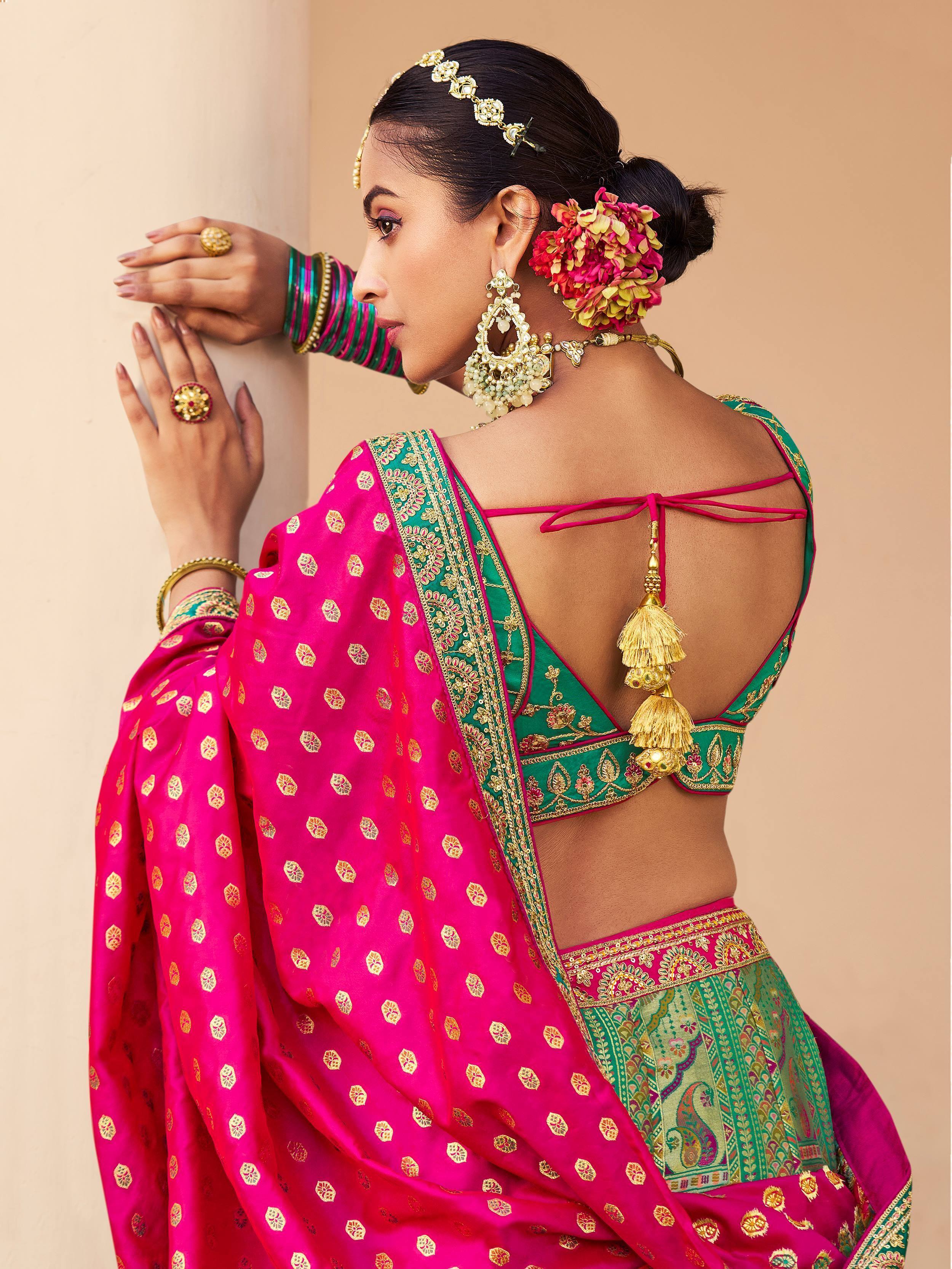Pink and green designer lehenga choli with back tie and gold tassels, ethnic Indian wear
