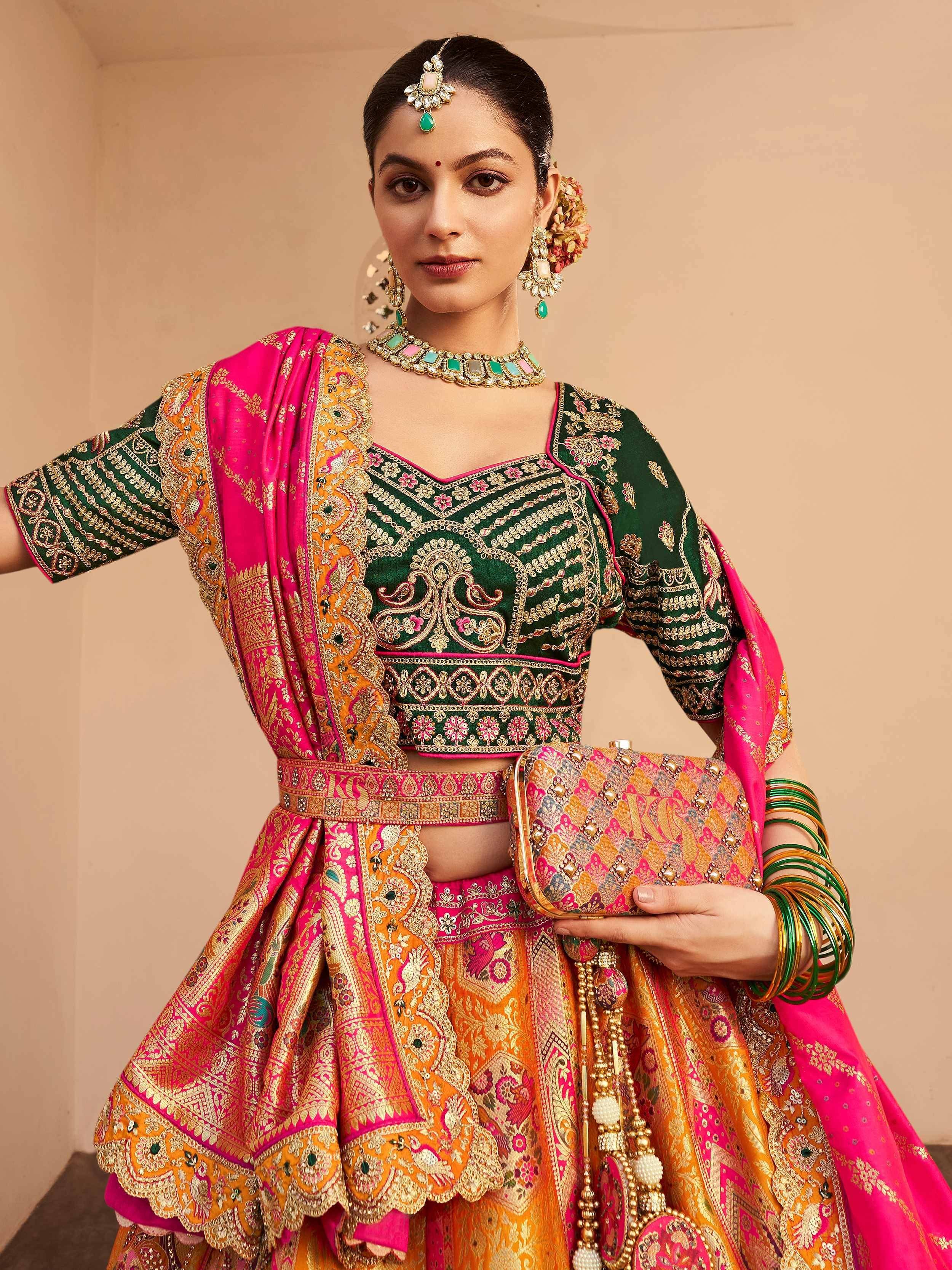 Green and pink embroidered lehenga choli with gold detailing, traditional Indian ethnic wear for weddings