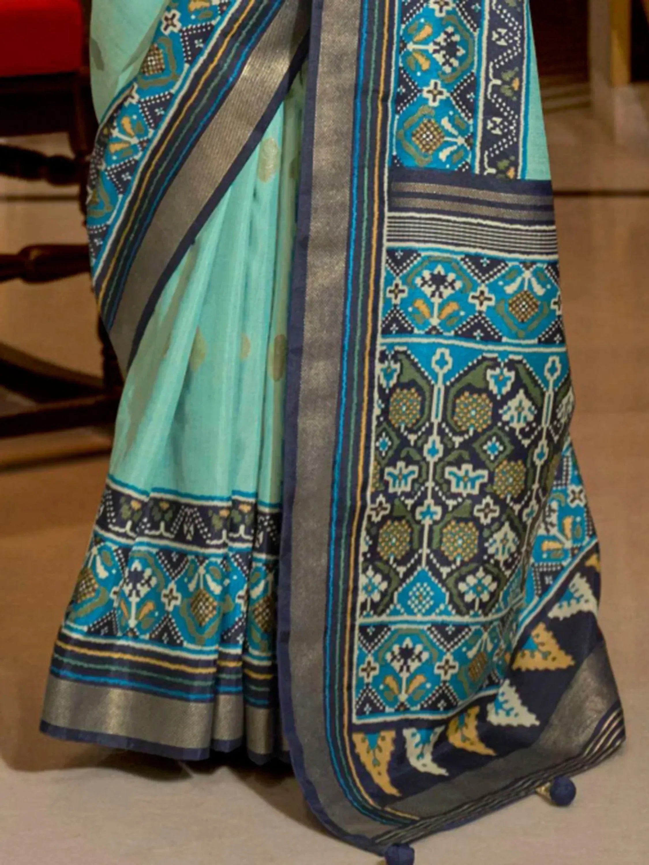 Mint green saree with blue and gold geometric border, ethnic Indian wear