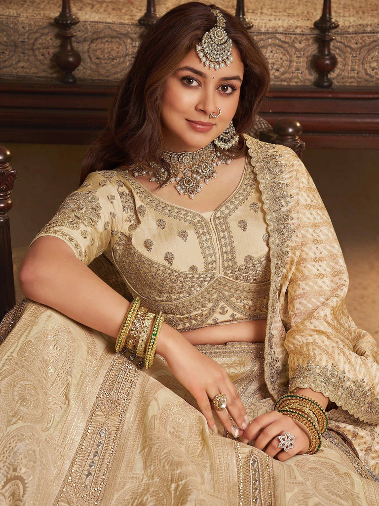 Fascinating Beige Embroidered Silk Wedding Wear Lehenga Choli