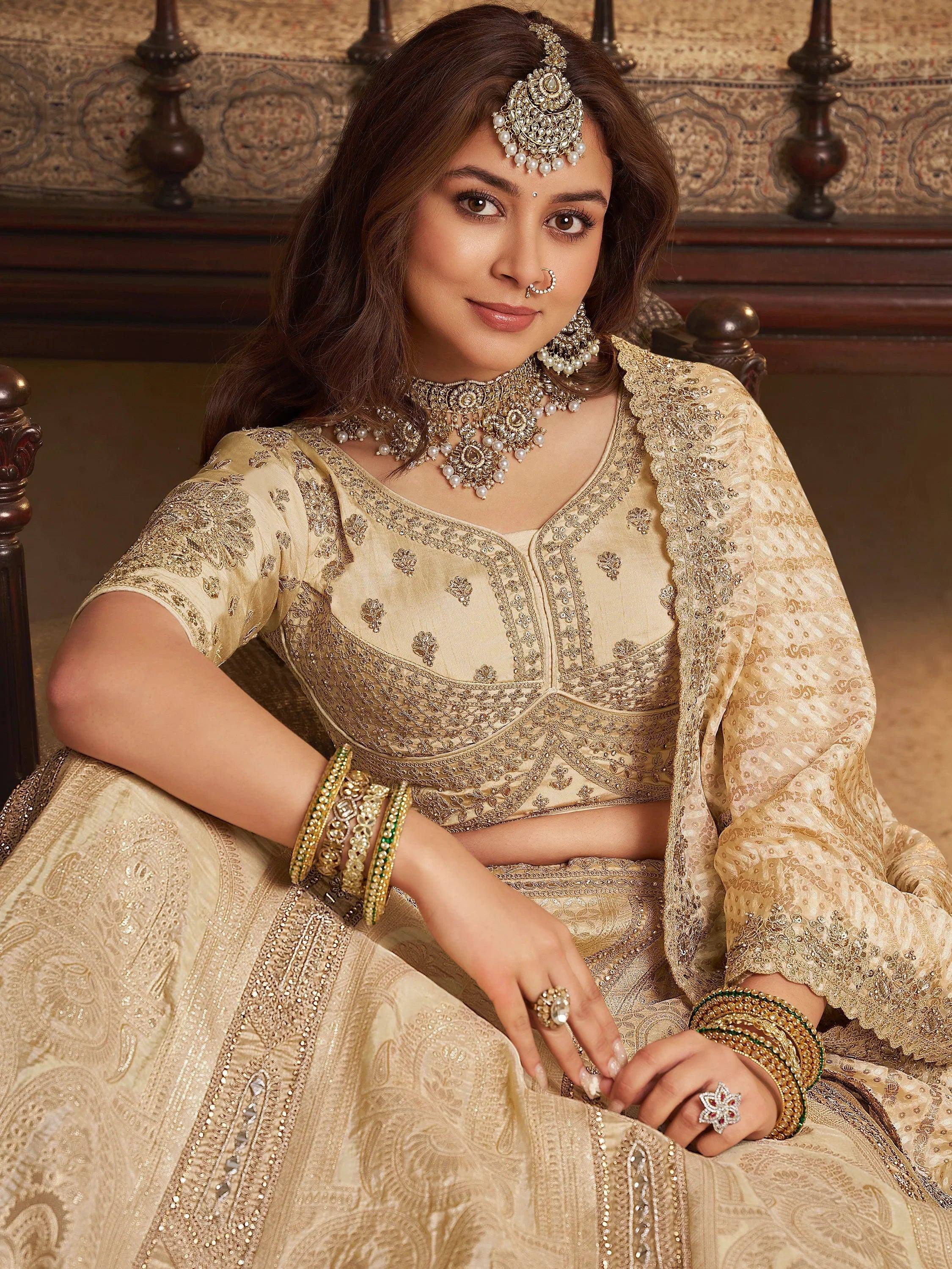 Fascinating Beige Embroidered Silk Wedding Wear Lehenga Choli