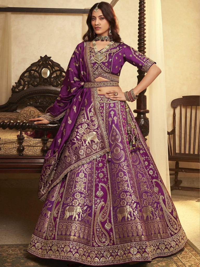 Purple designer lehenga choli with gold elephant embroidery, perfect for Indian weddings and festive occasions.