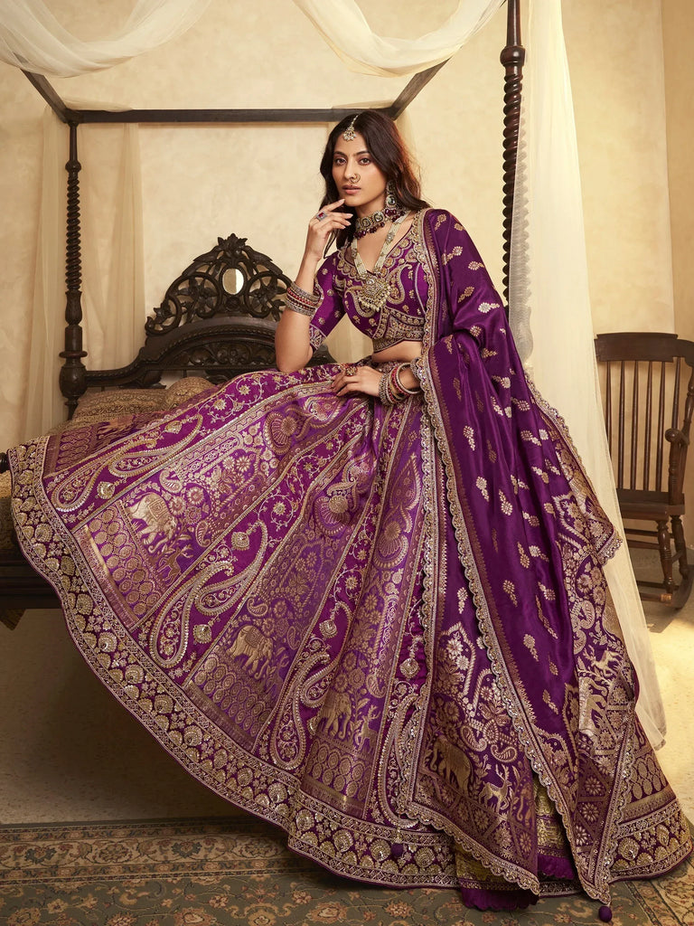 Purple designer lehenga choli with gold embroidery and elephant motifs, perfect for Indian weddings and festive occasions.