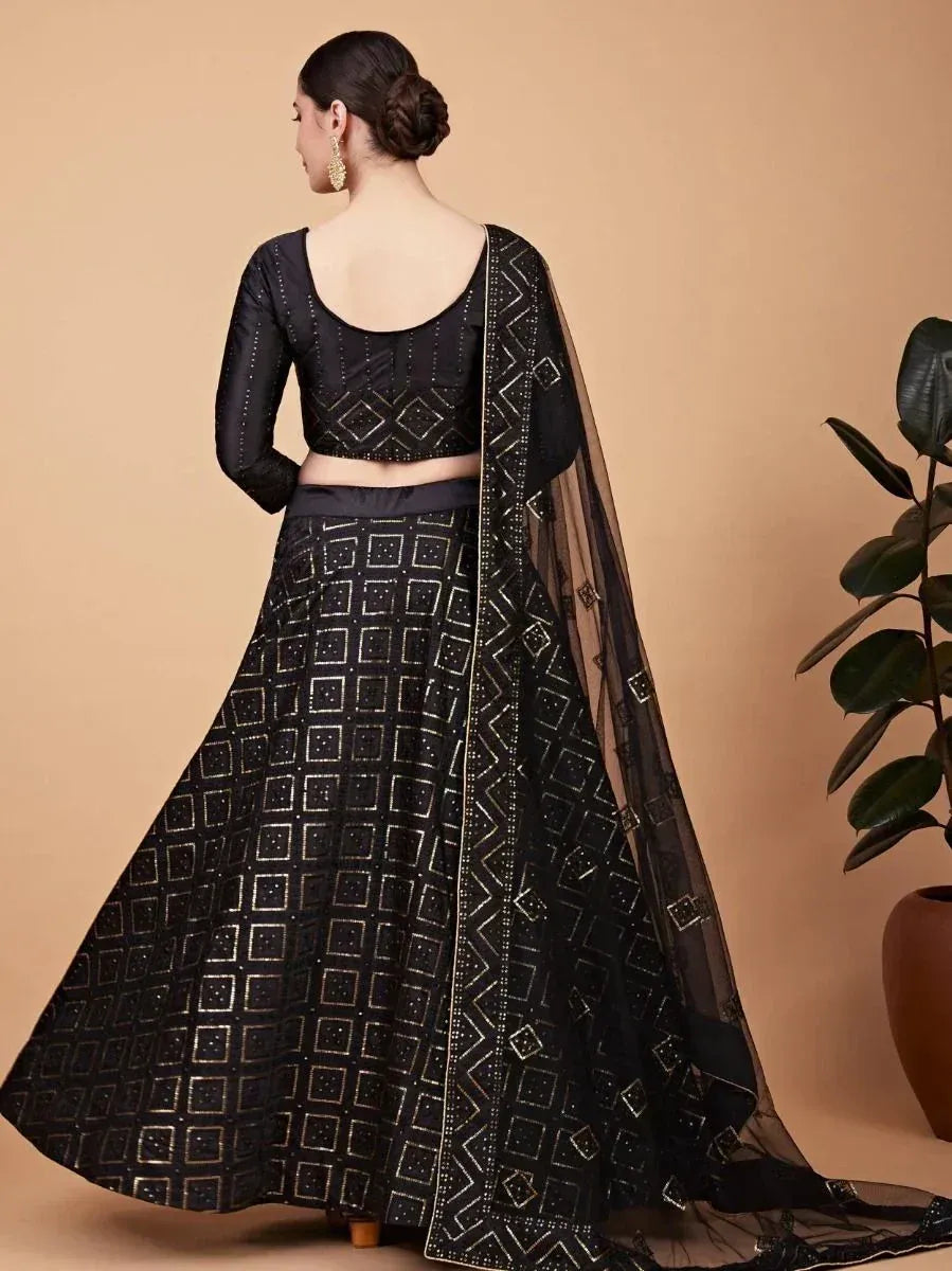 Black embroidered lehenga choli with geometric pattern and sheer dupatta, ideal for Indian ethnic wear