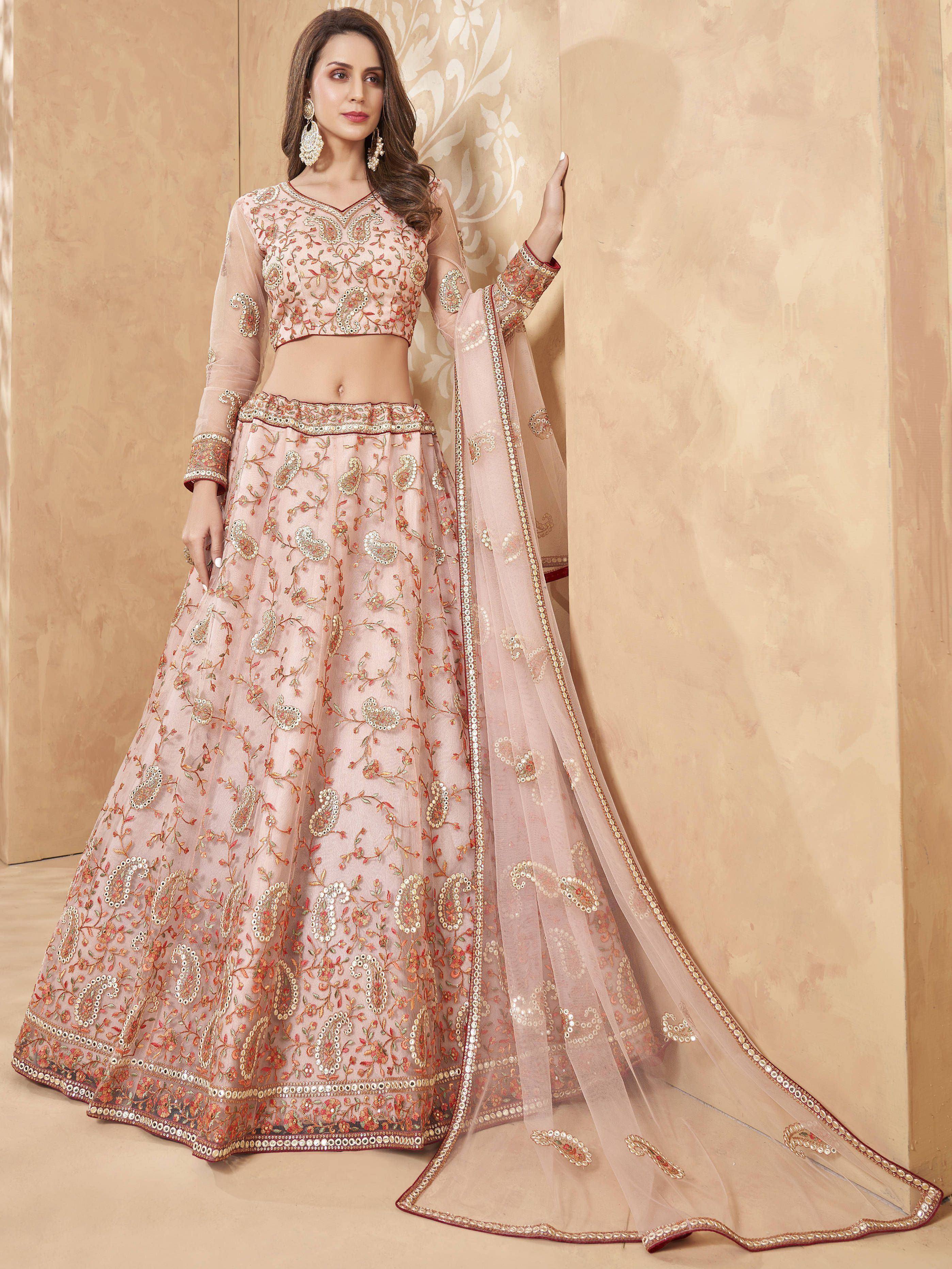 Pink embroidered lehenga choli with floral motifs and sheer dupatta, ideal for Indian weddings and festive occasions