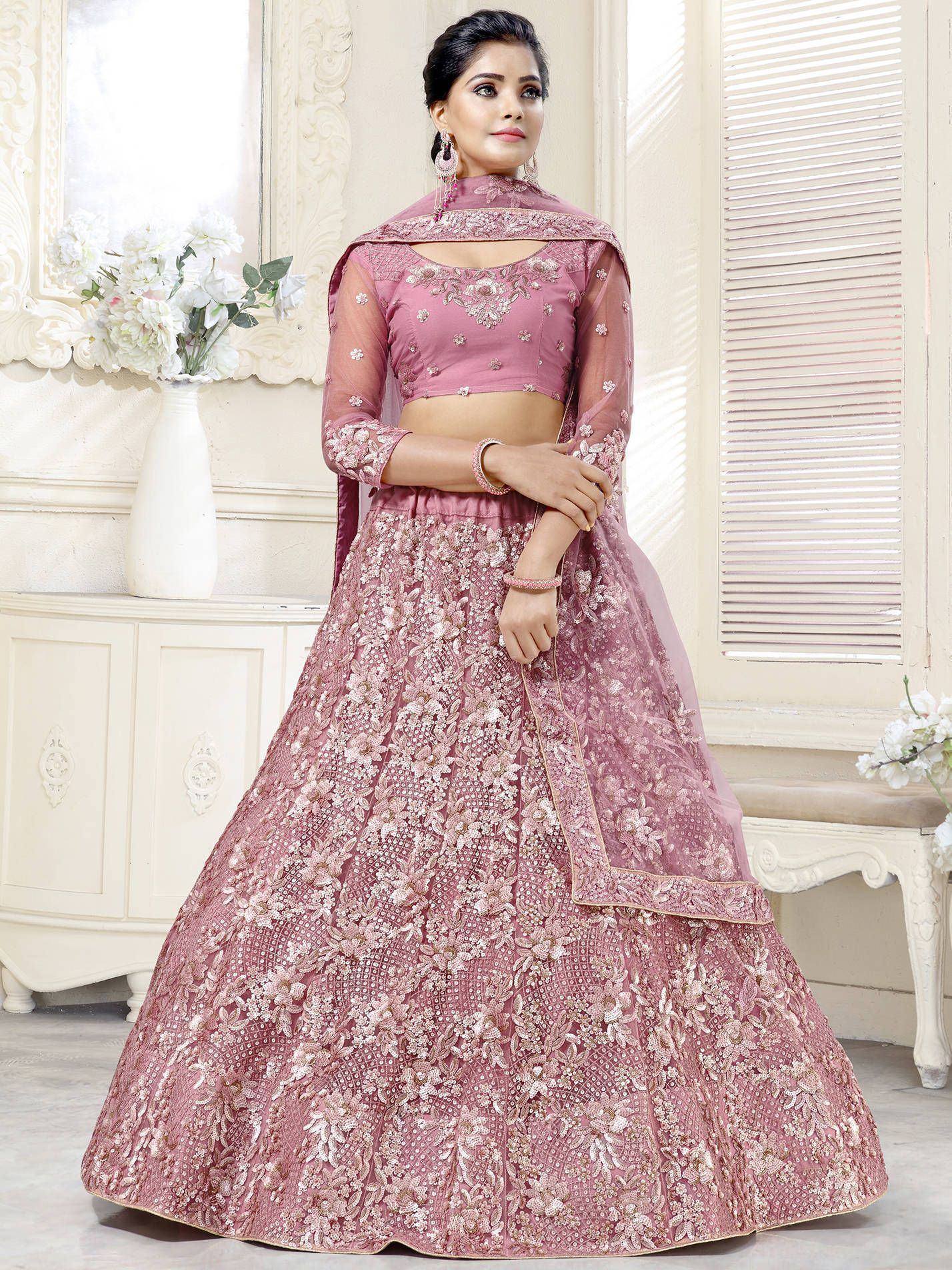 Pink embroidered lehenga choli with floral detailing, perfect for Indian weddings and festive occasions
