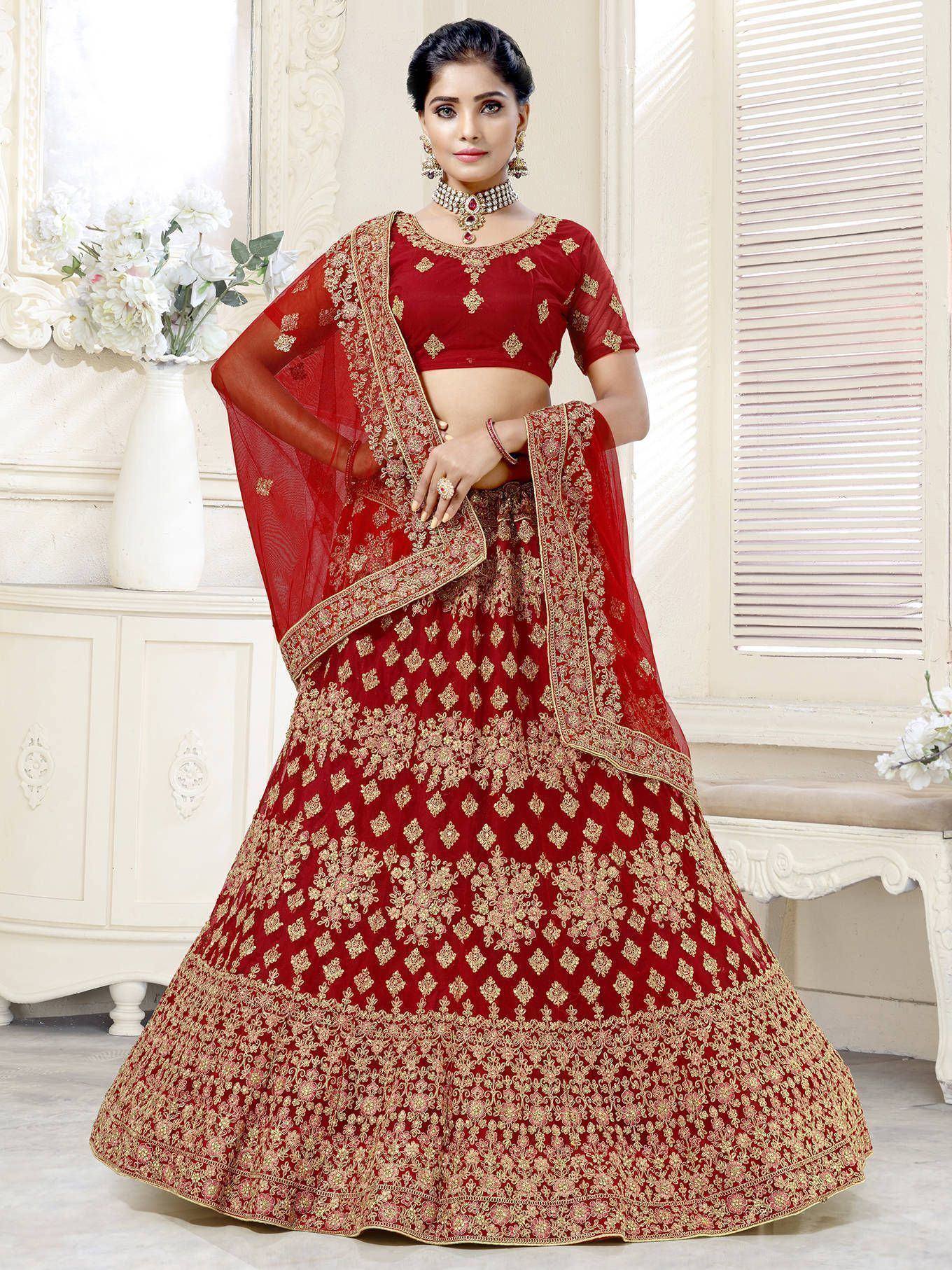 Red and gold embroidered lehenga choli with matching dupatta, perfect for Indian weddings and festive occasions.