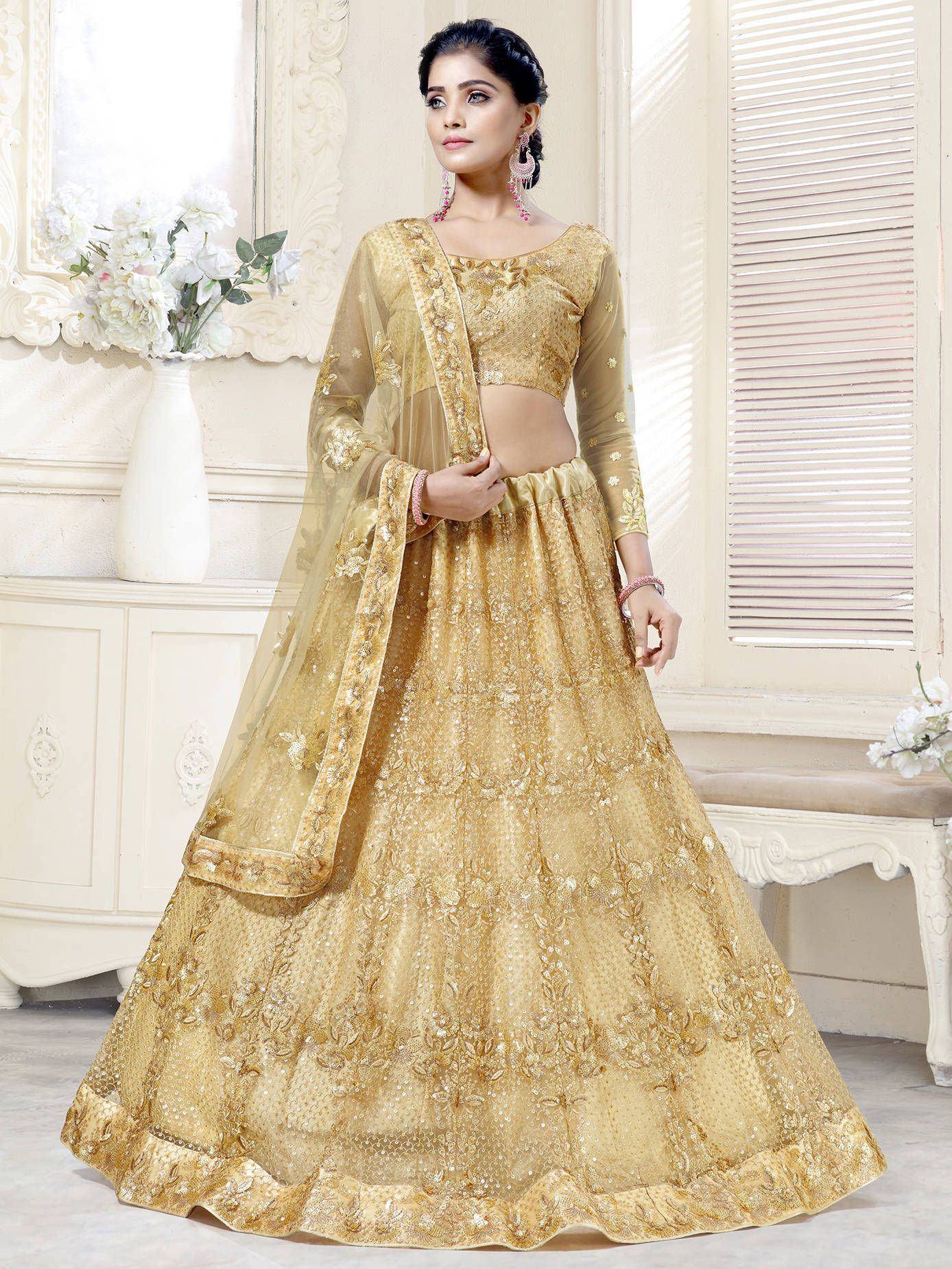 Golden embroidered lehenga choli with sheer dupatta, Indian ethnic wear for weddings and festivals