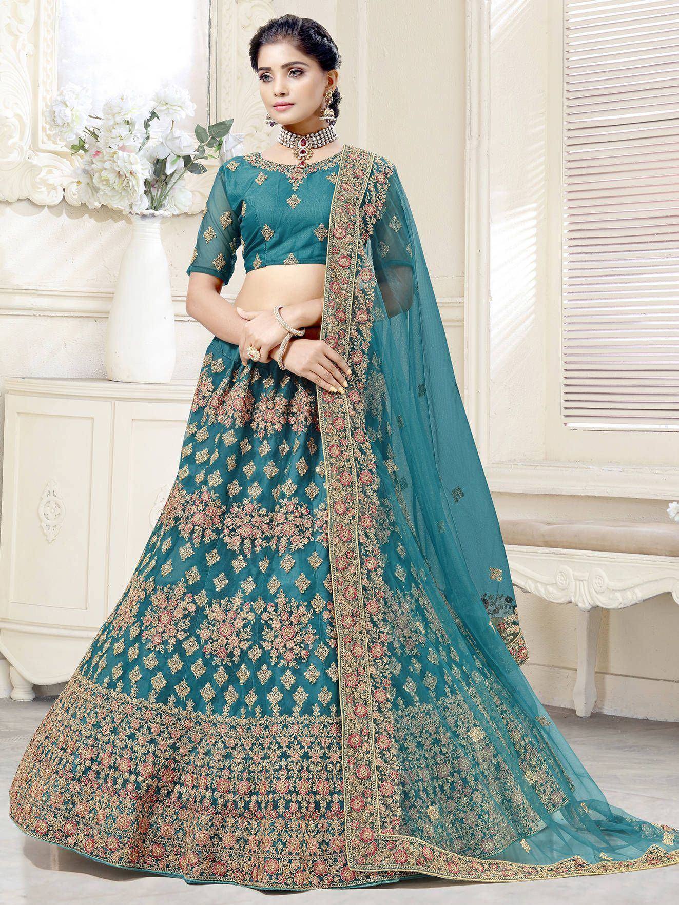 Teal embroidered lehenga choli with floral motifs and sheer dupatta, perfect for Indian ethnic occasions