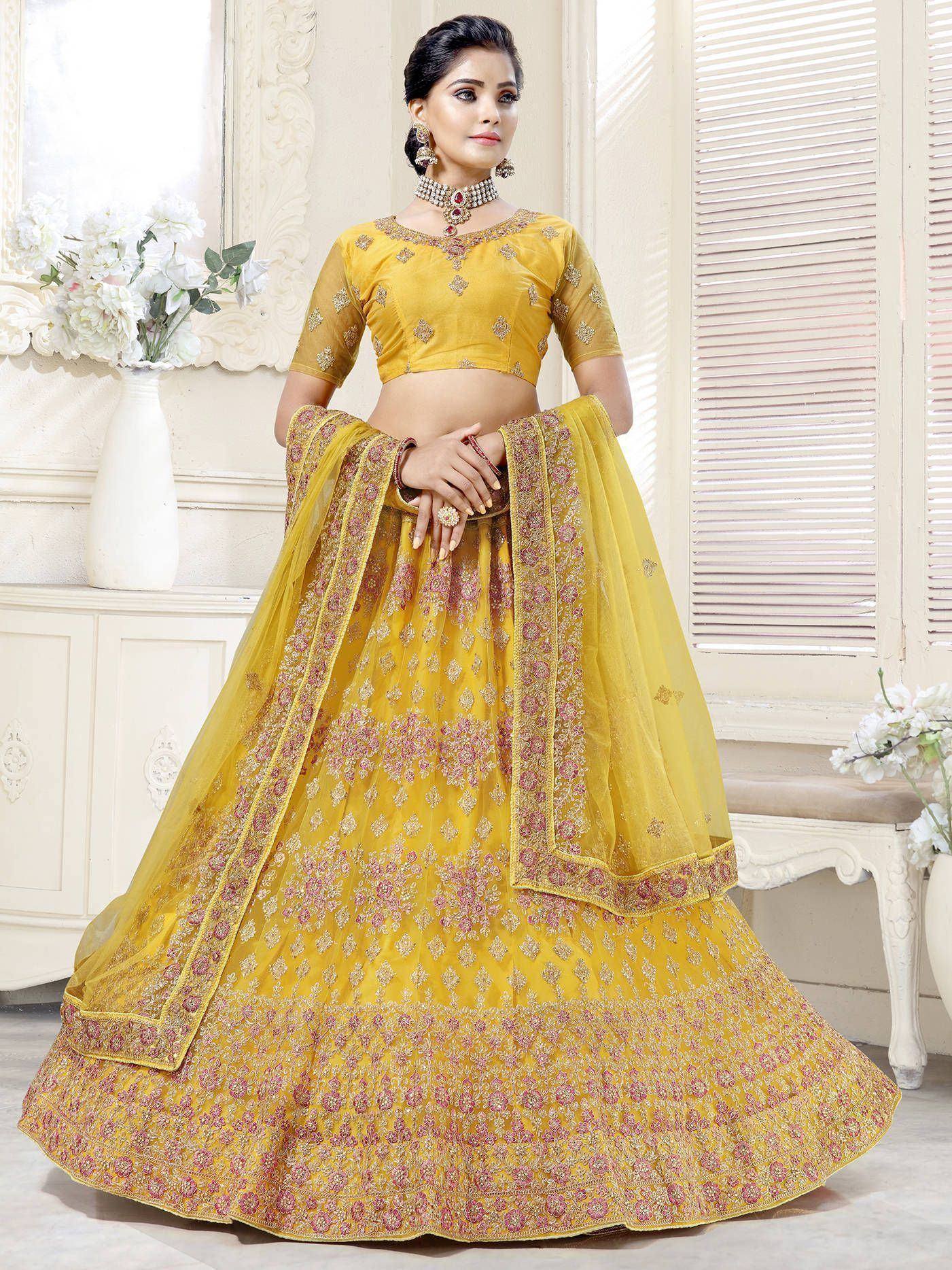 Yellow designer lehenga choli with floral embroidery, perfect for Indian weddings and festive occasions