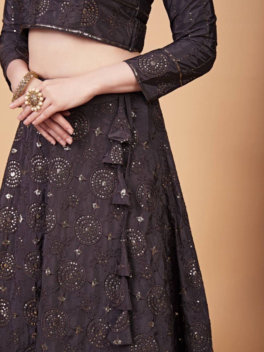 Black embroidered lehenga choli with sequin work and ruffle detailing, perfect for ethnic occasions.