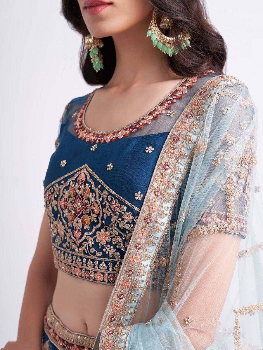 Blue embroidered lehenga choli with floral detailing and sheer dupatta, perfect for Indian ethnic wear