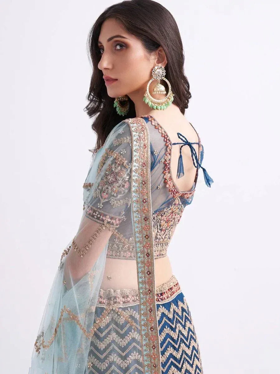 Blue embroidered lehenga choli with sheer dupatta and back tie detail, perfect for Indian ethnic wear