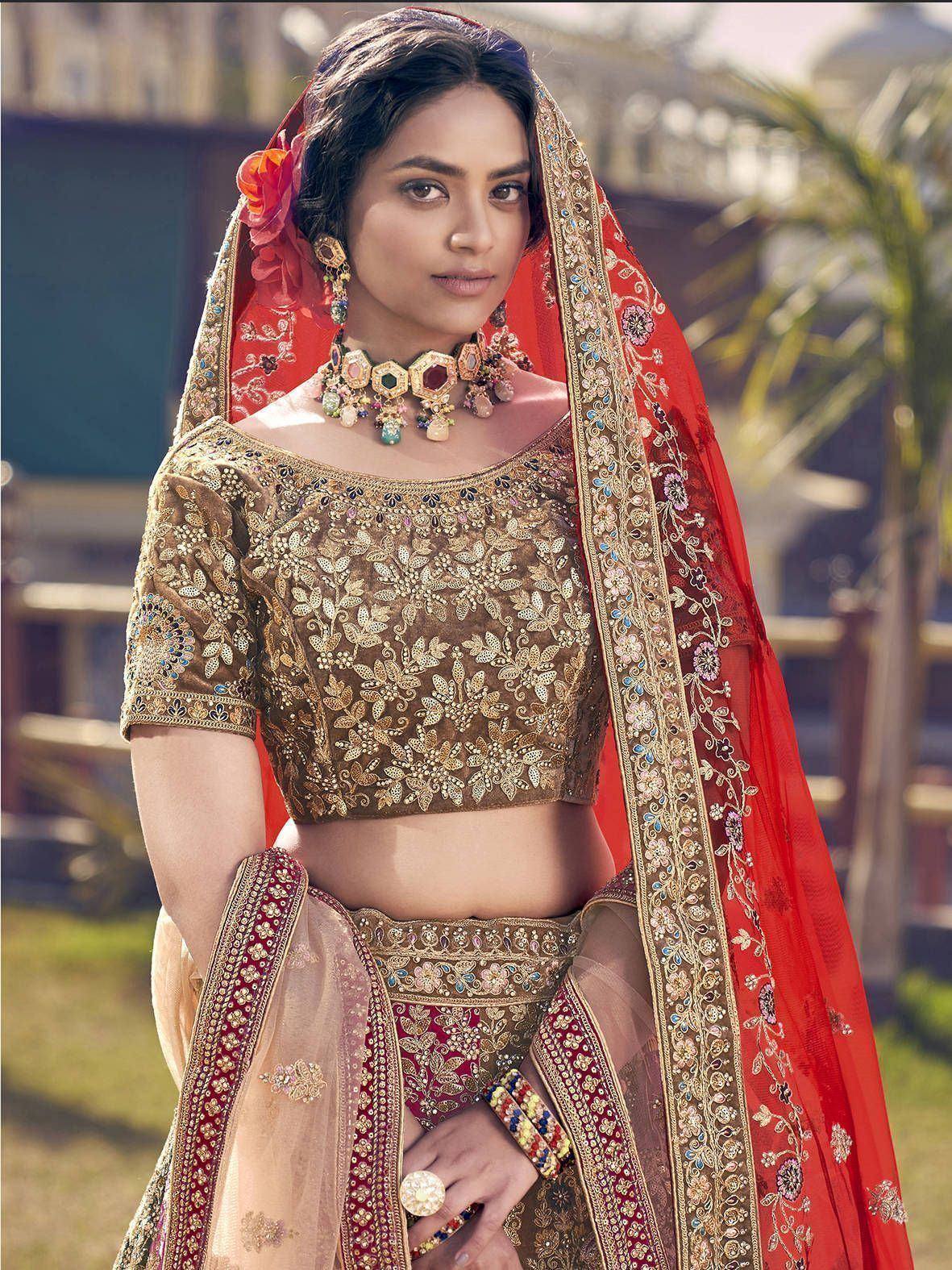 Gold embroidered lehenga choli with red dupatta, perfect for Indian weddings and festive occasions