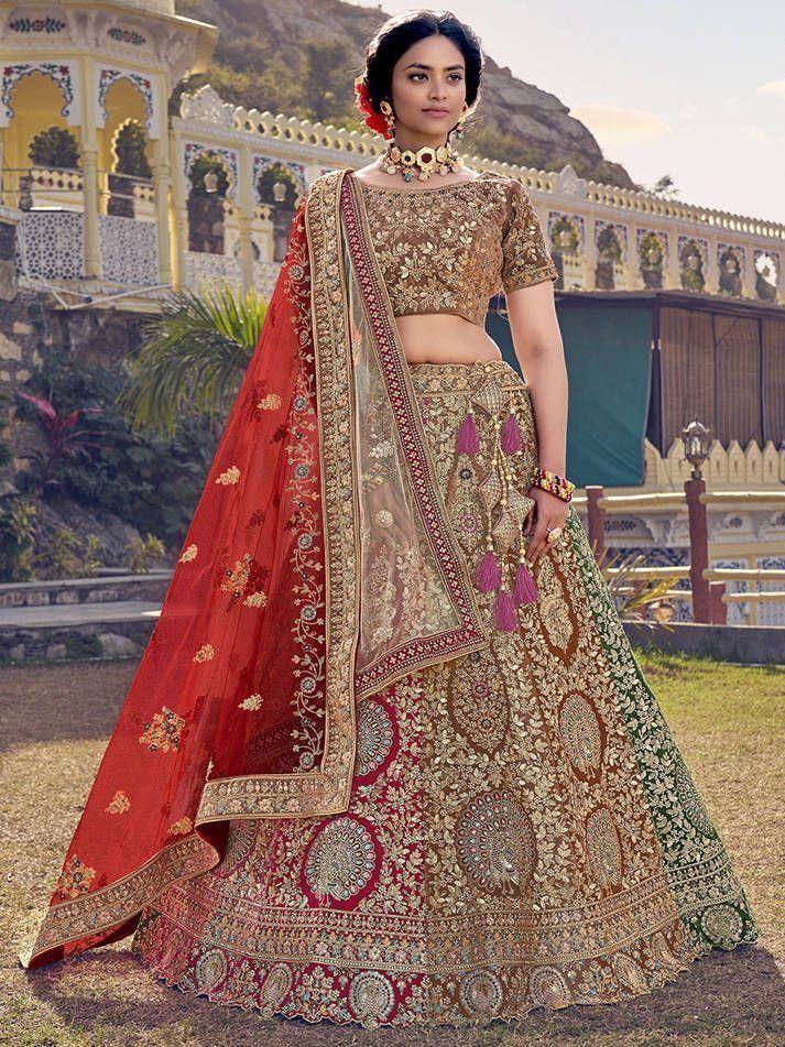 Designer lehenga choli with intricate embroidery, red dupatta, and gold embellishments for Indian ethnic wear