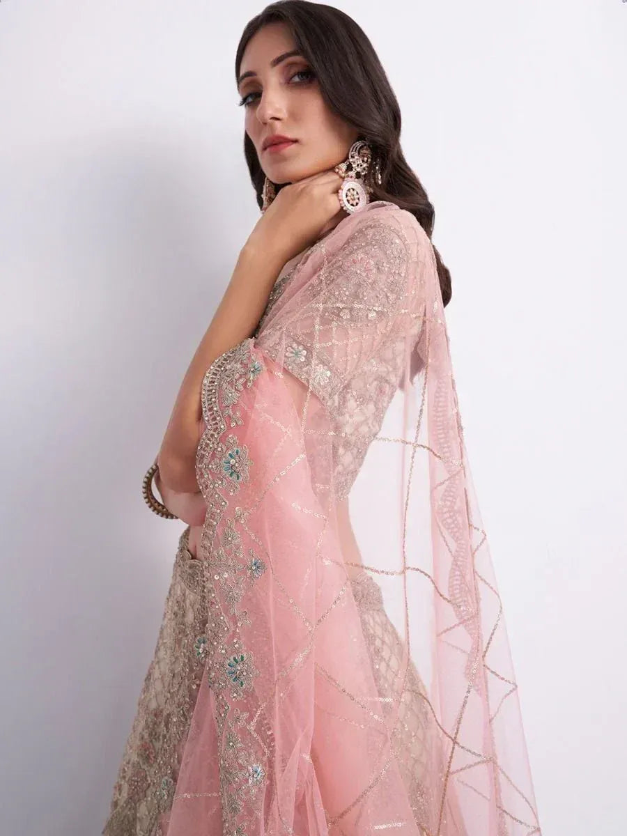 Pink embroidered lehenga choli with sheer dupatta, perfect for Indian ethnic wear occasions
