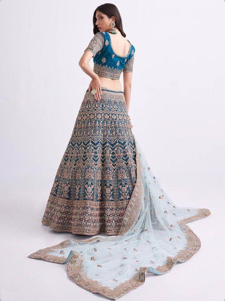 Sumptuous Teal Blue Cording Work Net Bridal Lehenga Choli